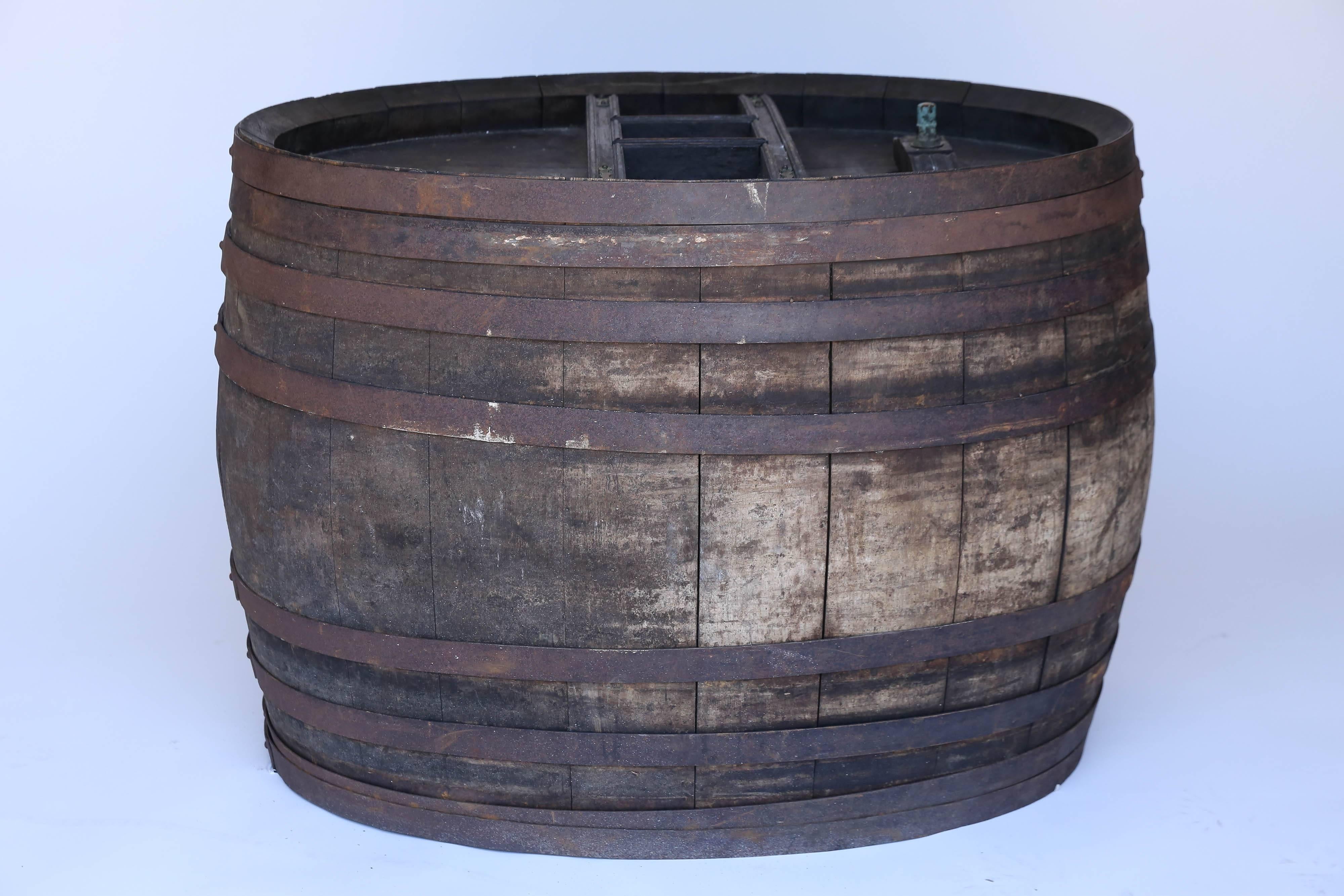 This large, rustic French oak wine barrel would be perfect for any wine aficionado or in a wine room. It would also make an interesting table with the addition of a glass top.