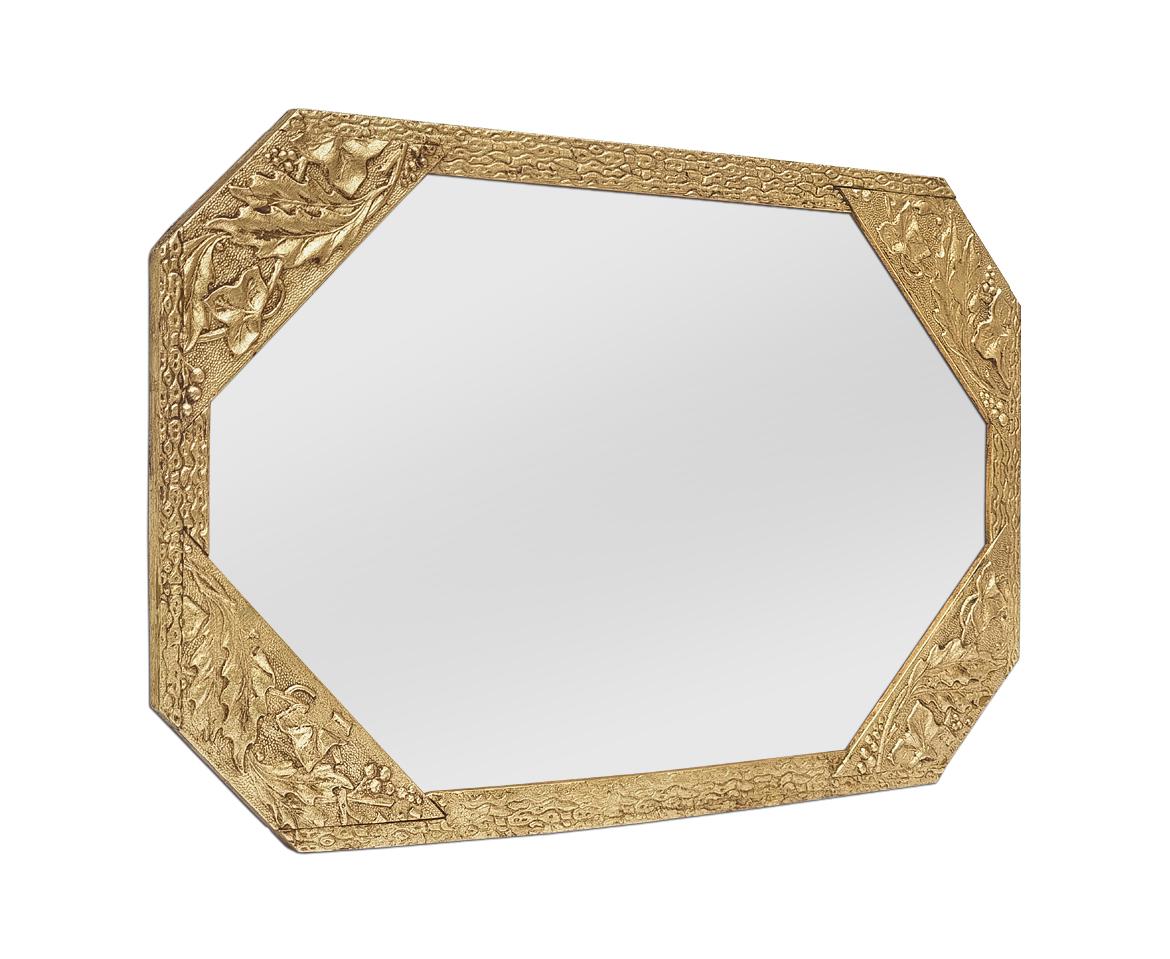 Small octagonal gilded Art Nouveau antique mirror, circa 1900. Decorated with holly leaves and ivy in the corners and stylized friezes. Antique frame re-gilding with leaf. Frame width: 2 - 5.5 cm / 0.78 - 2.16 in. Modern glass mirror. Wood back.