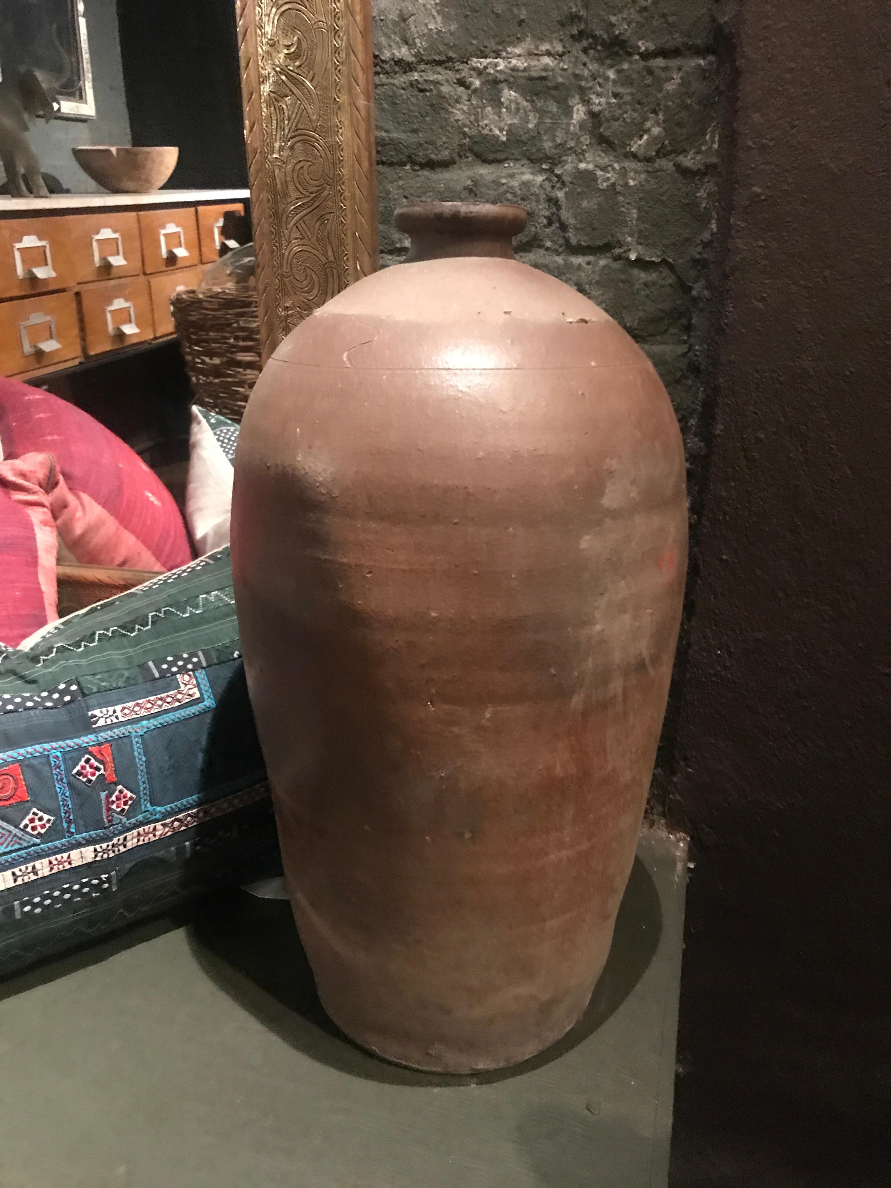 Antique 19th century French olive oil jug, used long ago for storing oil, with the typical French glaze, hand thrown. A perfect piece with country charm, with the traditional ribbed surface, and pouring opening.