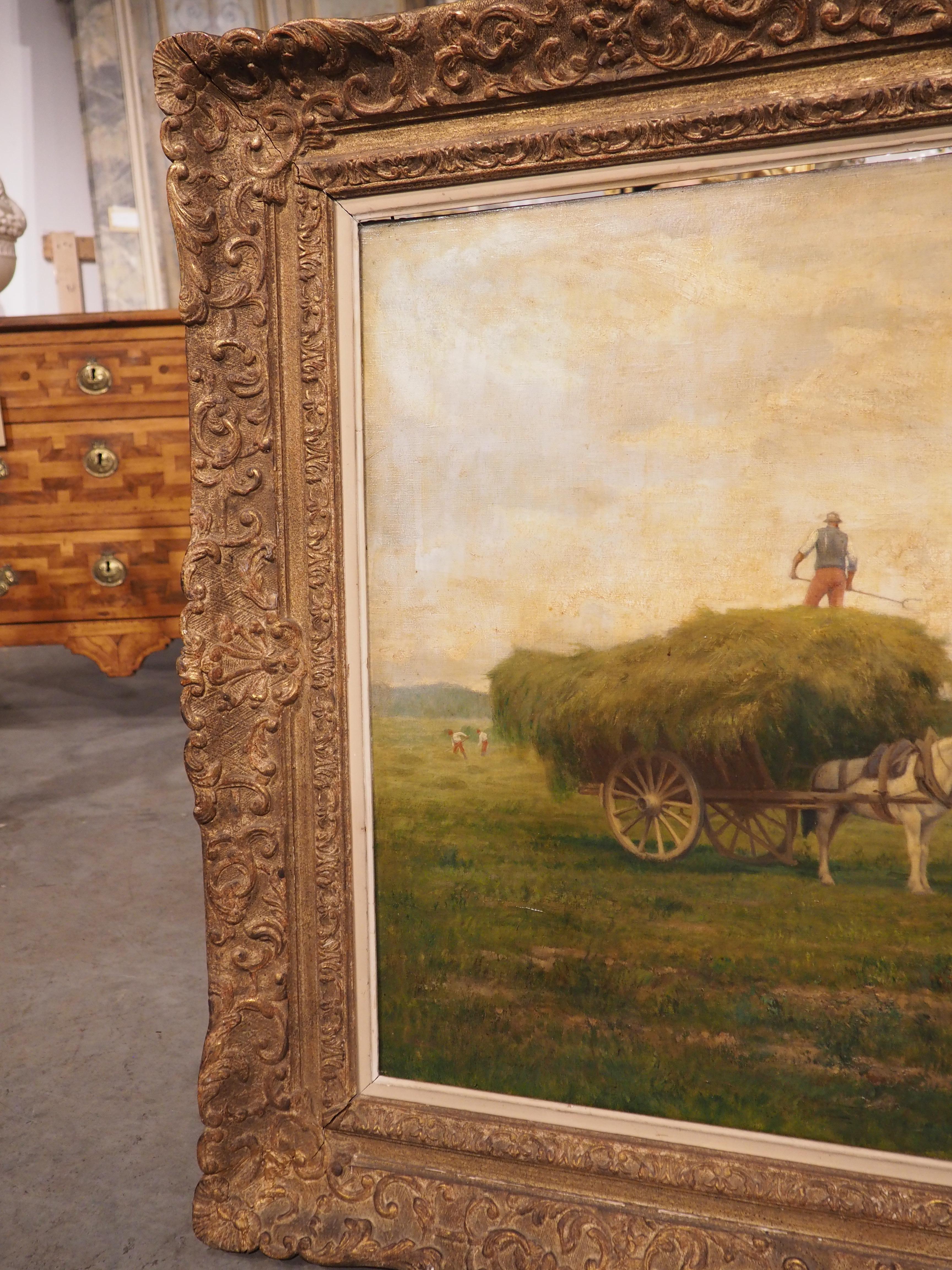 Antique French Oil Painting, A Hay Collection Scene by Emile Lienard In Good Condition In Dallas, TX