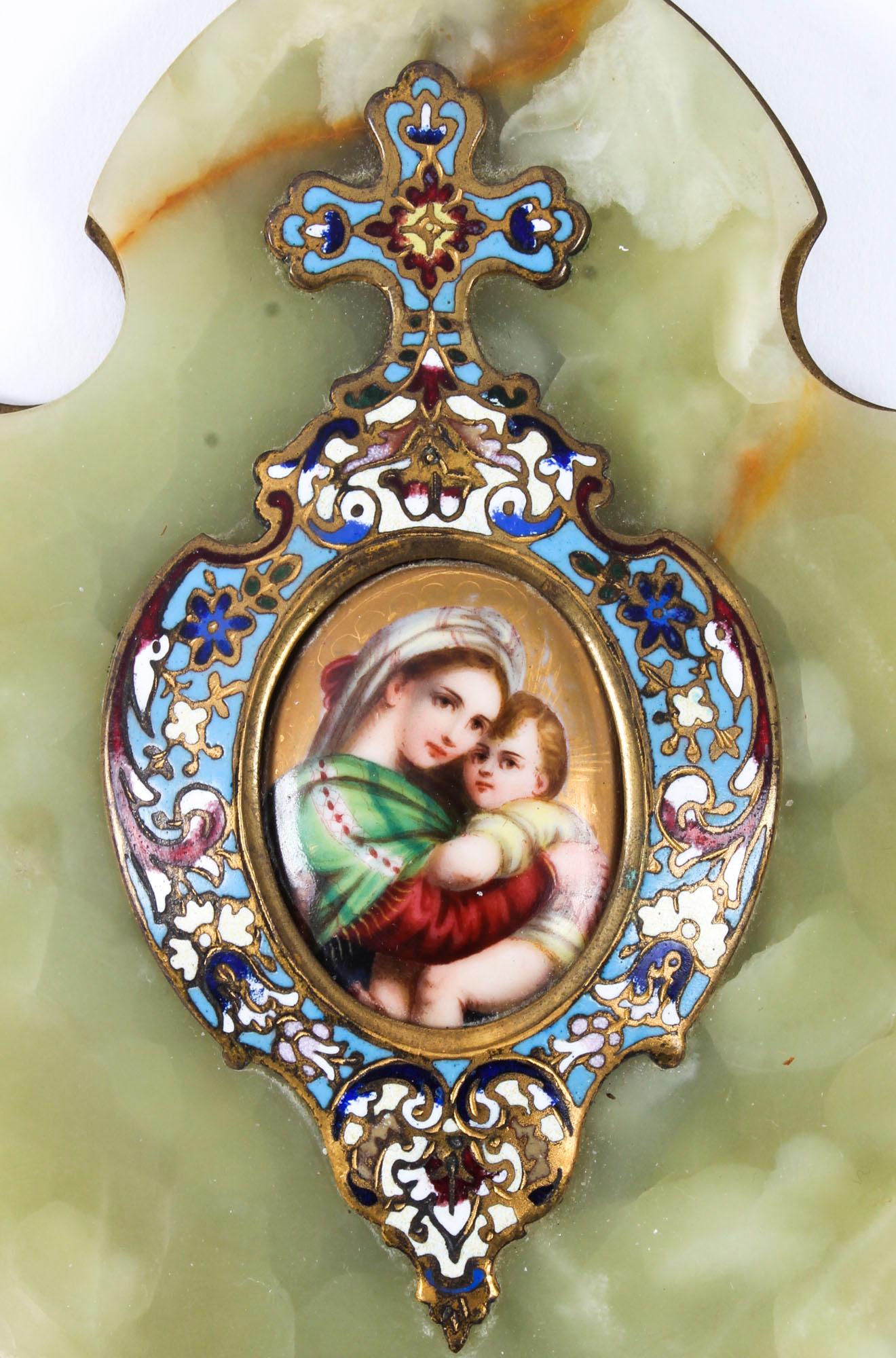 This is a beautiful champlevé enamel and brass decorated onyx wall hanging holy water stoop, dated 2nd July 1900.

The shaped onyx is mounted on a bronze base, the champlevé enamel is decorated in royal blue, pink and red and is surmounted with a