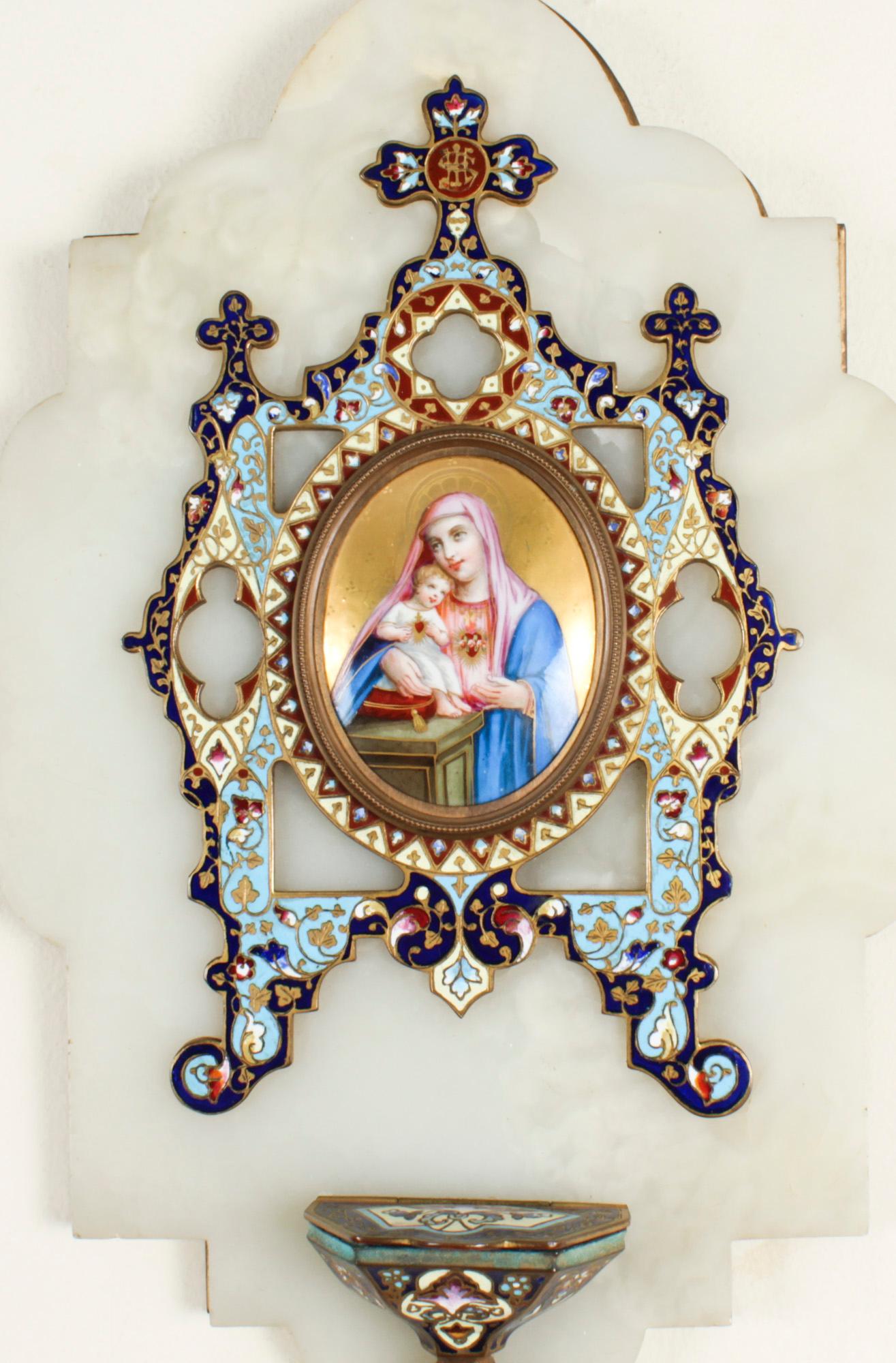This is a beautiful large antique onyx, cloisonne' enamel decorated wall hanging holy water stoop, Circa 1880 in date.
 
The shaped marble surround is mounted on a gilt ormolu base. It is centred by an oval porcelain hand-painted portrait of the
