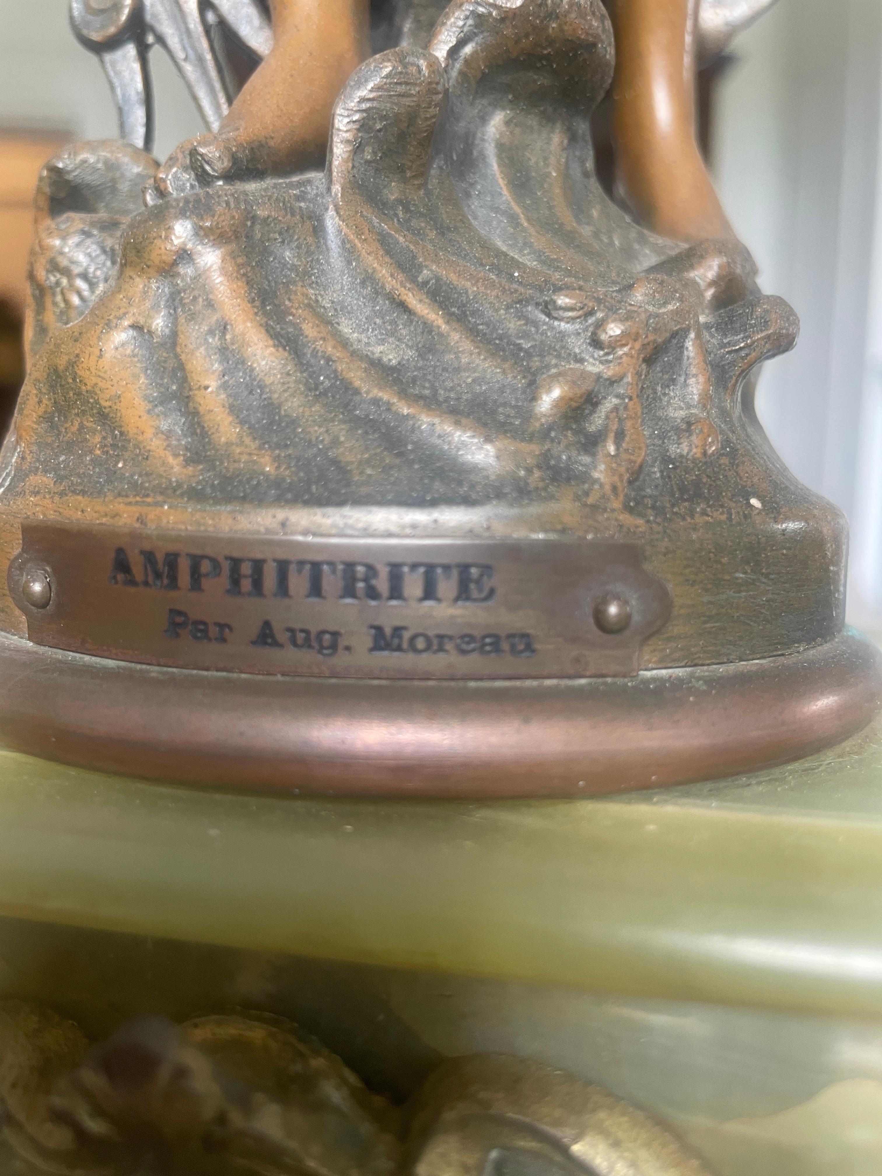 Antique French onyx and clock having a quality painted dial, original hands and eight day movement striking on the hour and half hour on a bell. A beautiful quality onyx case surmounted by a spelter figure of Amphitrite after Moreau, Auguste