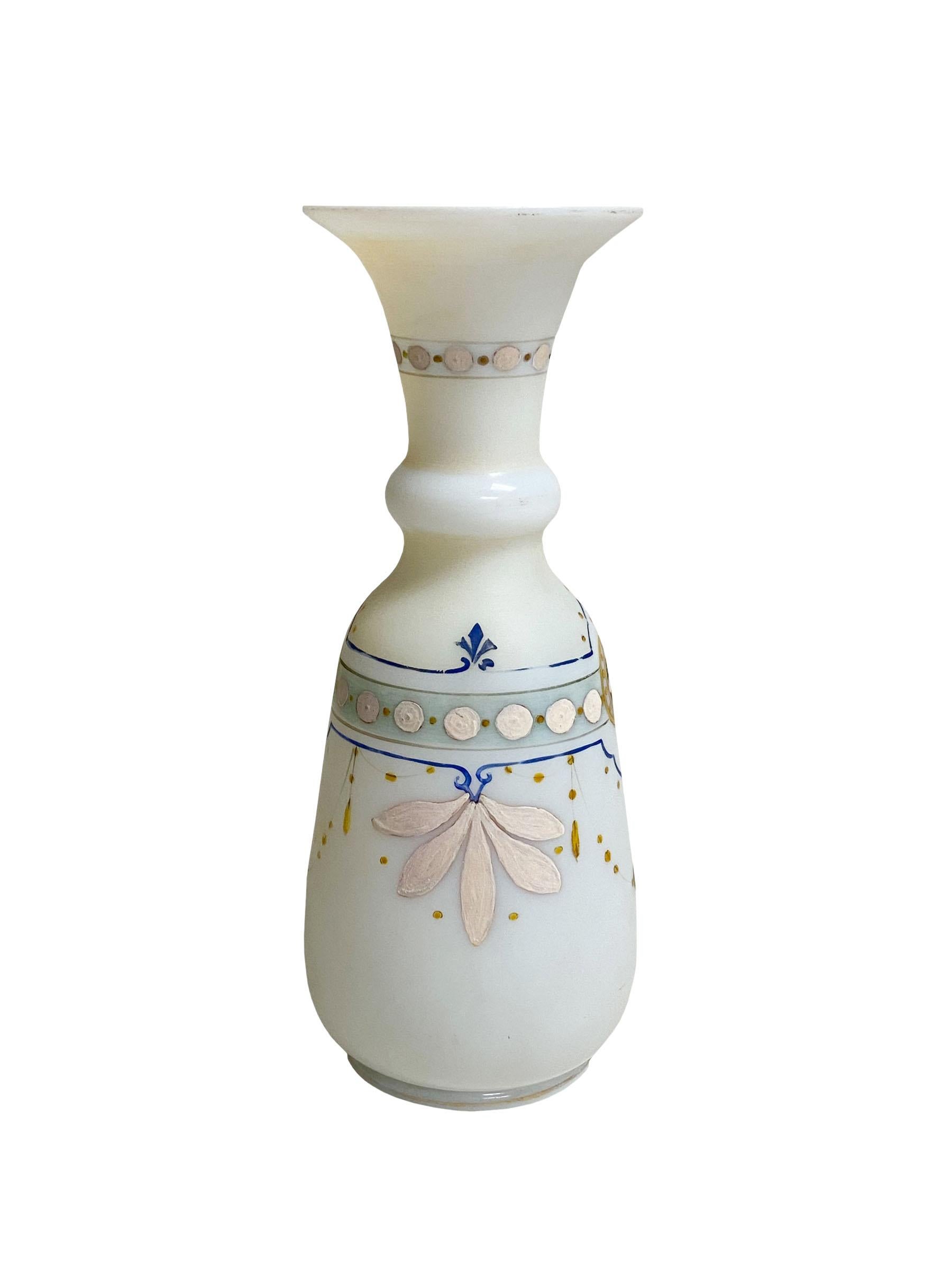A delightful French hand painted opaline vase. Very delicately painted design of garlands in gold, blue and cream accents.