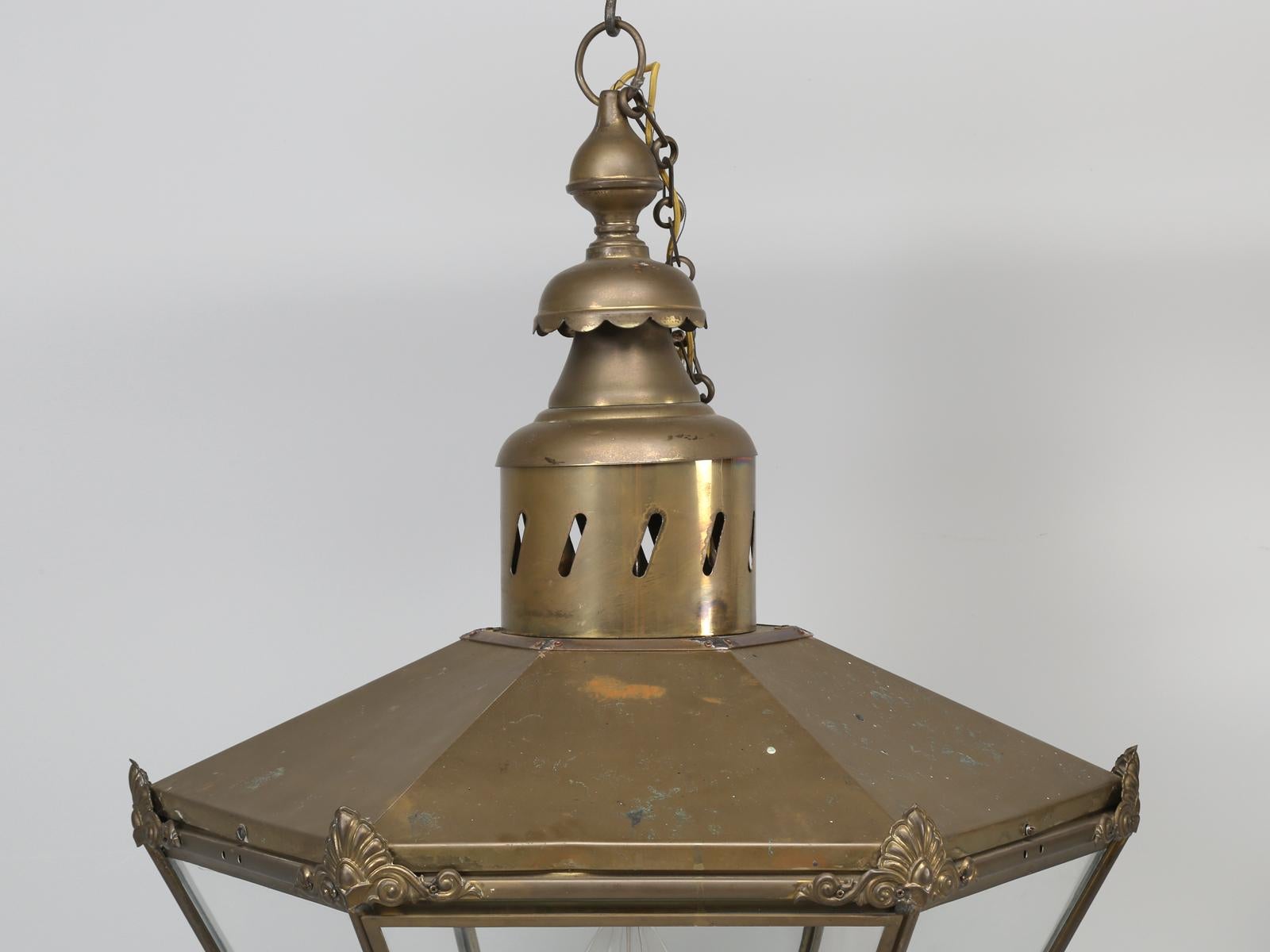 Antique French or English, very large brass lanterns. Although we purchased this brass lantern in France, there is a part of us, that thinks they could have originated in England? What we find most unusual about this pair of antique lanterns, other