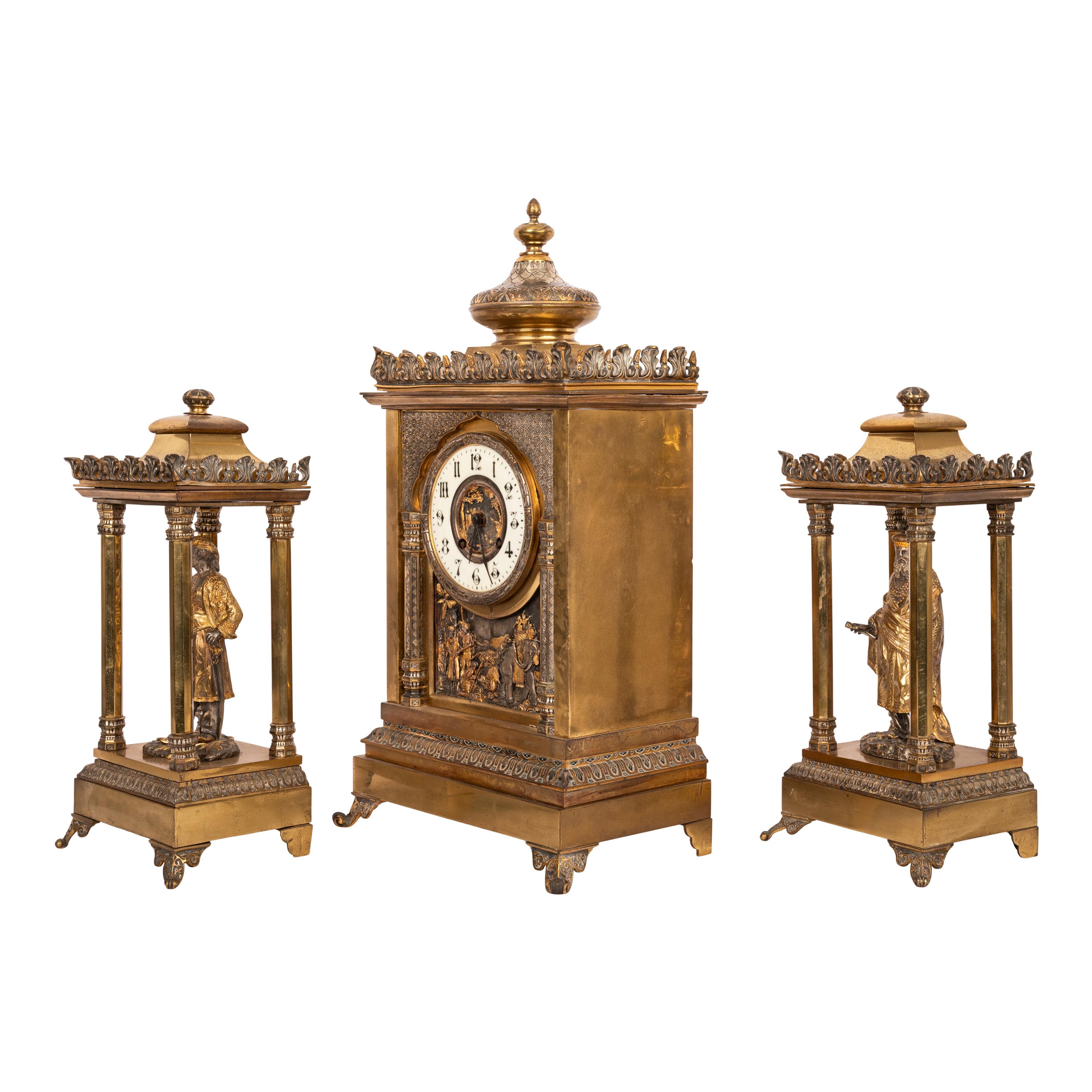 A Fine & important French bronze statue 8 day clock garniture in the Orientalist style, circa 1880. 
The 8 day clock with a time and strike mechanism, sounding the hours and half hours on a pleasant mellow sounding bell. The clock is house in a