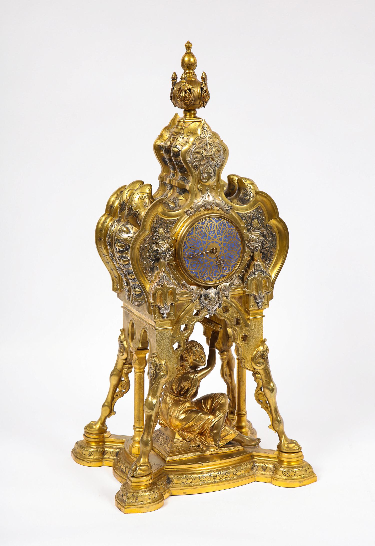A very unusual 19th century antique French orientalist/Moorish silvered bronze, gilt bronze and champleve enamel figural clock, signed Boulez, marks on movement ROBLIN & FILS FRERES, A Paris, 32499. Found in the middle of the clock is a seated