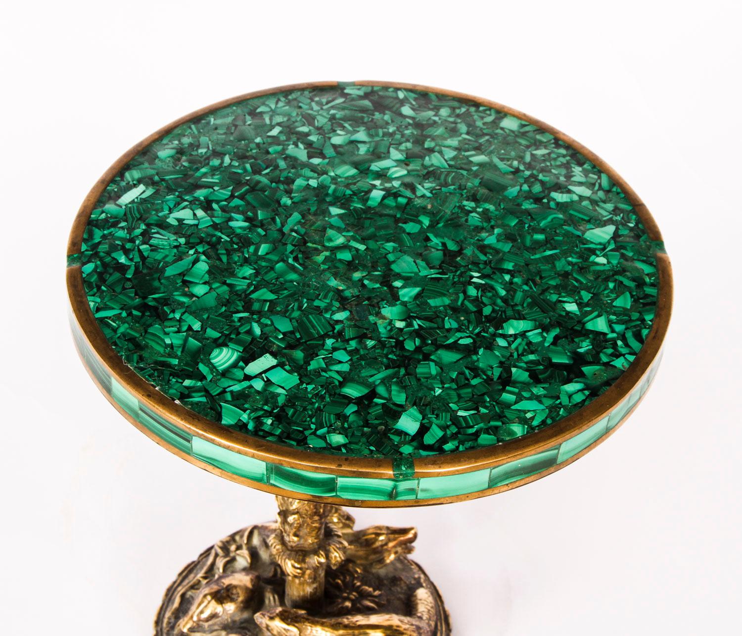 A French ormolu and malachite miniature table circa 1880 in date.

The miniature table with circular malachite top and border, the ormolu base cast in the Naturalist manner with a monkey climbing a tree, above a 'Palissy-esque' arrangement of