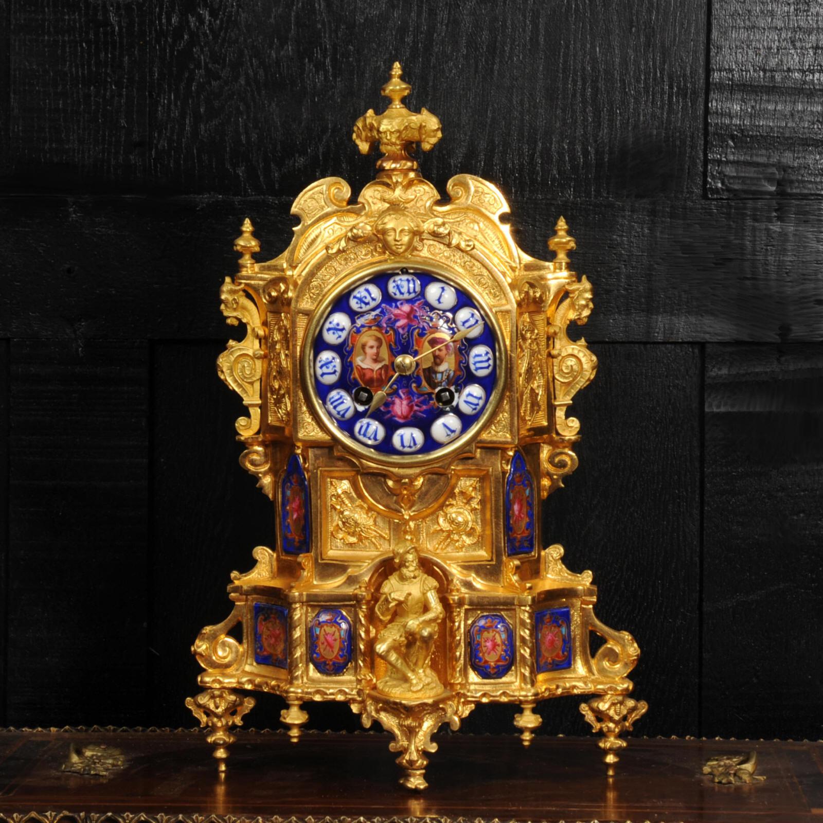A lovely, early ormolu (finely gilded bronze) Gothic clock mounted with exquisite porcelain panels with a royal blue ground. These are beautifully decorated with heraldic motifs. The dial has a portrait of a royal couple and to the front of the