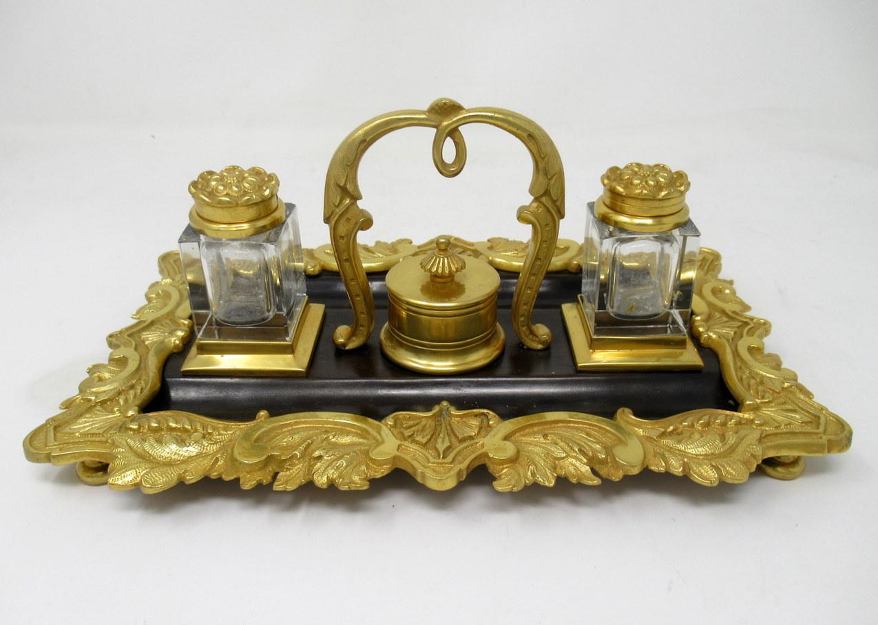 Superb example of a French ormolu and patinated bronze heavy gauge twin ink desk stand of rectangular outline, circa 1875, possibly earlier, 19th century.

The lavish cast ormolu frame with Acanthus leaf detail in Art Nouveau taste surrounds a