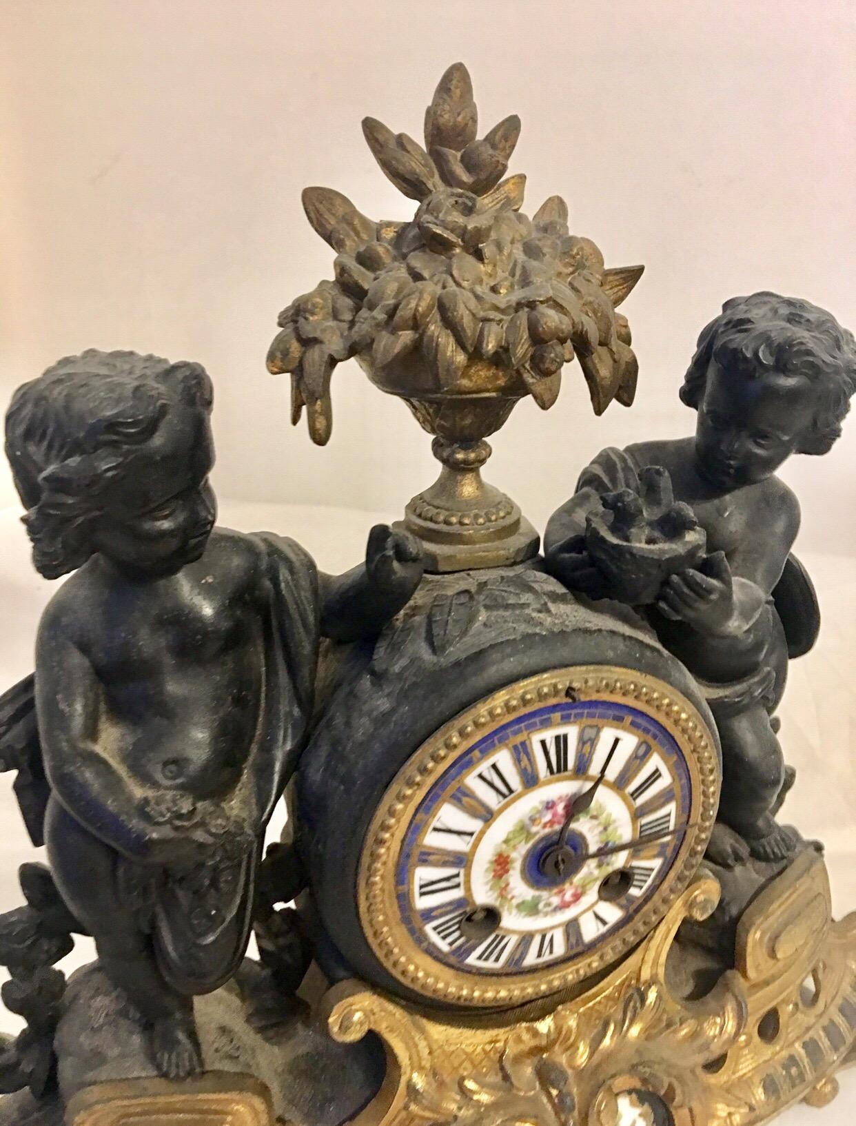 Bronzed Antique French Ormolu Cherub Striking Mantel Clock For Sale