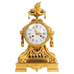 Antike französische Goldbronze-Trommelkopf-Uhr mit Löwenmasken