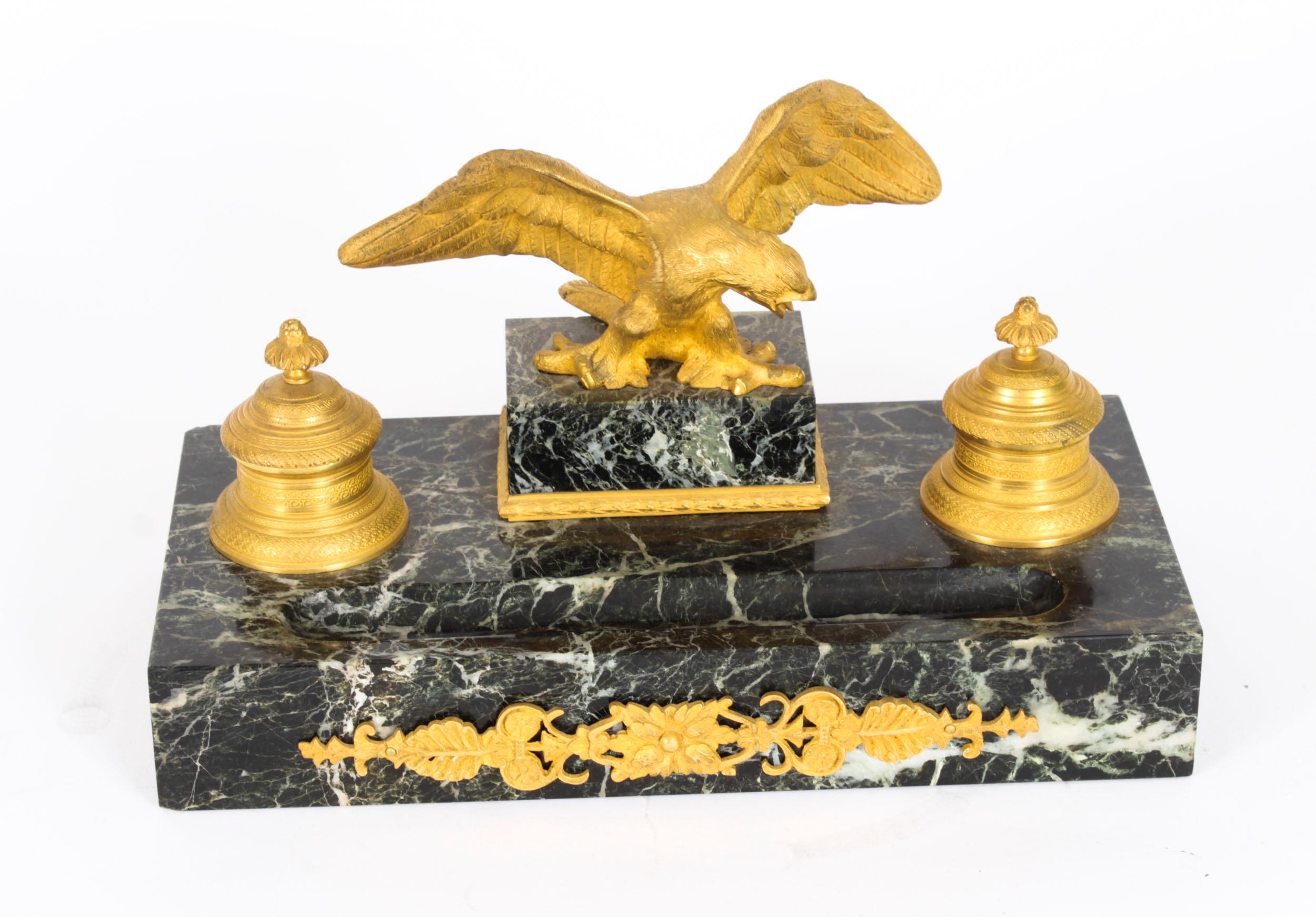 This is a wonderful antique French Empire Revival ormolu mounted and patinated Verde Antico marble inkstand, Circa 1870 in date.

Of rectangular form with a pair of raised inkwells having ormolu covers, surmounted by a central spread eagle.

There