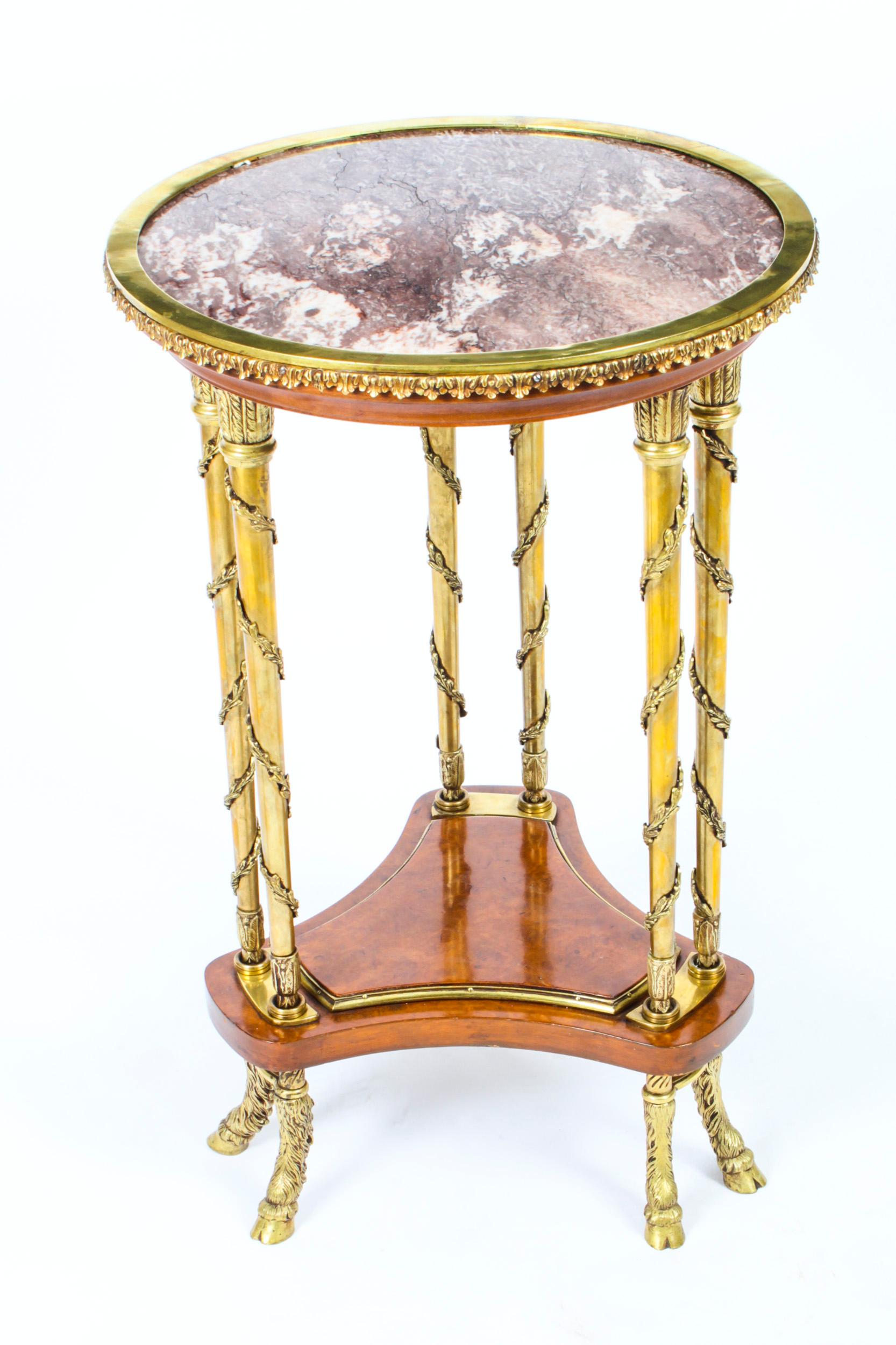 An fine Antique French Amboyna Ormolu & Marble occasional table Circa 1880 in date.
 
The table features a circular Russian Gris St. Anne violet marble top with ormolu banding, on three ormolu twin columns decorated with trailing vines united by a