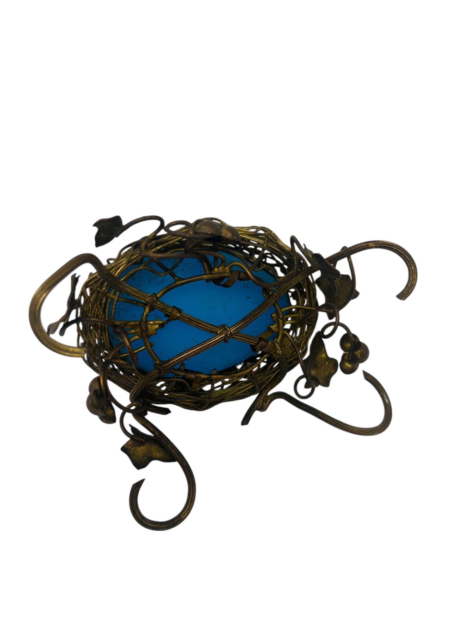Antique French Ormolu Mounted Green Opaline Egg Form Covered Box. The egg form opaline box rests in a gilt bronze nest of grapes and leaves. The box opens to reveal a small compartment.