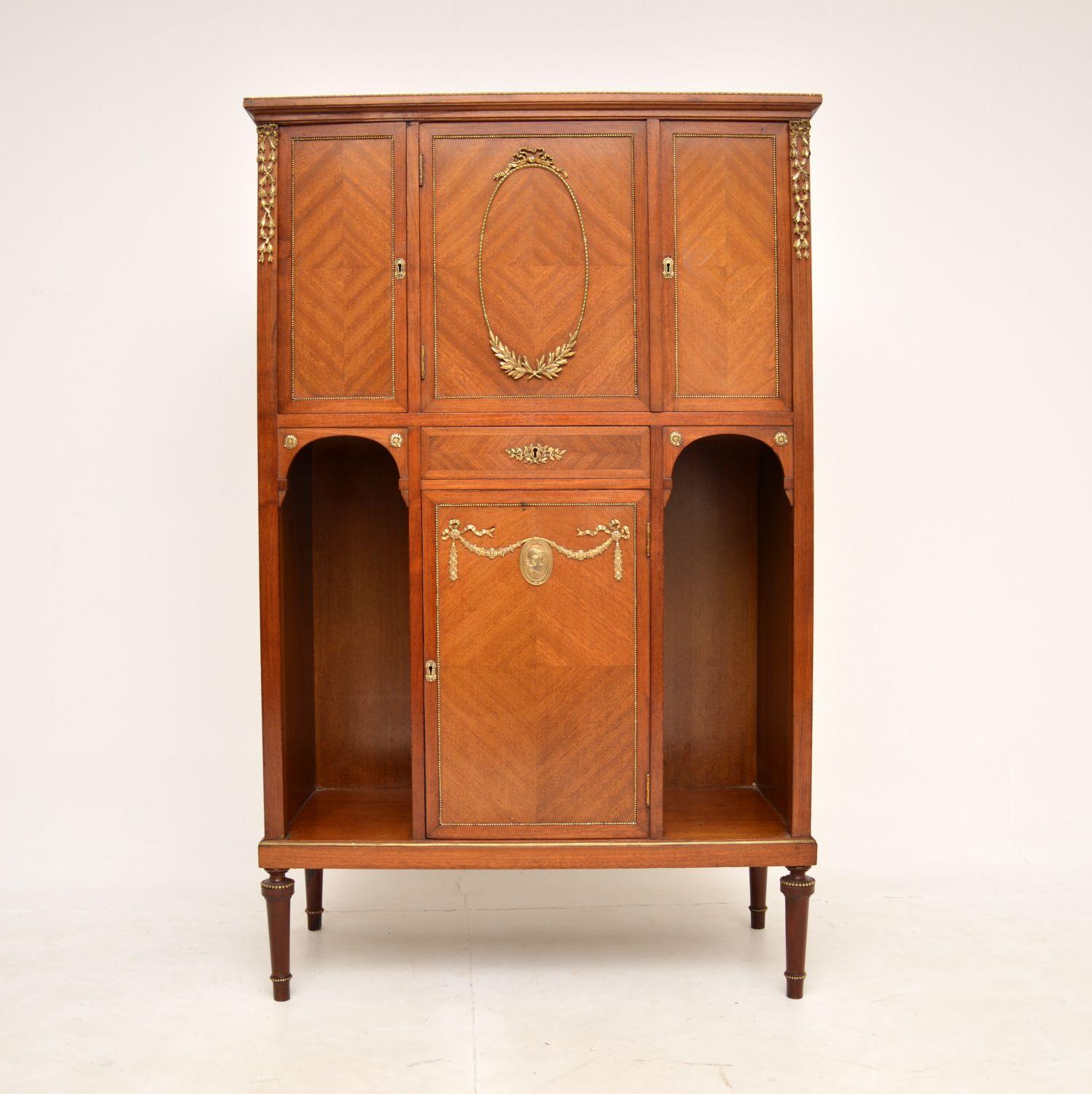 A beautiful original antique cabinet, this was made in France and dates from around the 1890-1910 period.

It is of superb quality, with stunning ormolu mounts throughout. There is lots of storage space inside, this is a useful size and is perfect