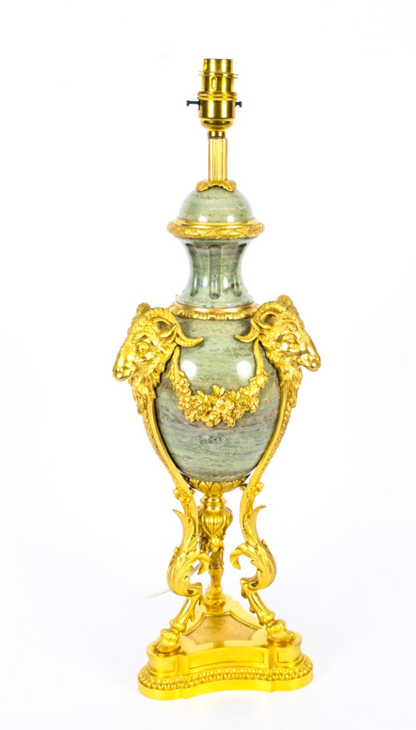 A beautiful French lime marble and ormolu mounted table lamp, C1880 in date.

This beautiful ormolu mounted mable table lamp is decorated with superb ormolu floral garlands with rams head mounts on tripod acathus legs with hoof feet with a