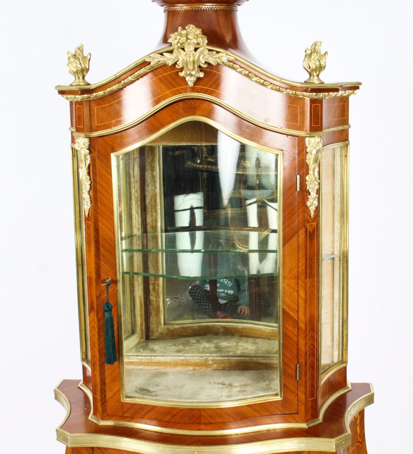 This is a beautiful antique French Louis Revival wood, marquetry and ormolu mounted display cabinet, circa 1870 in date.

This beautiful cabinet has an abundance of exquisite ormolu mounts as well as intricate inlaid floral and foliate marquetry