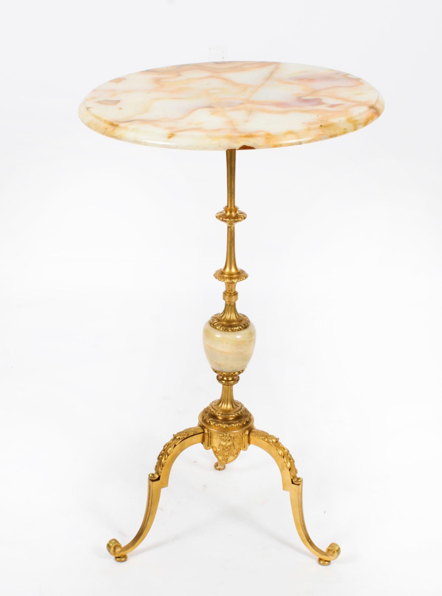 An Antique French Ormolu and Onyx occasional table Circa 1880 in date.
 
The circular table features an urn shaped stem, leaf cast scrolled cabriole legs and a decorative onyx top.
 
Add some French sophistication to your home with this amazing