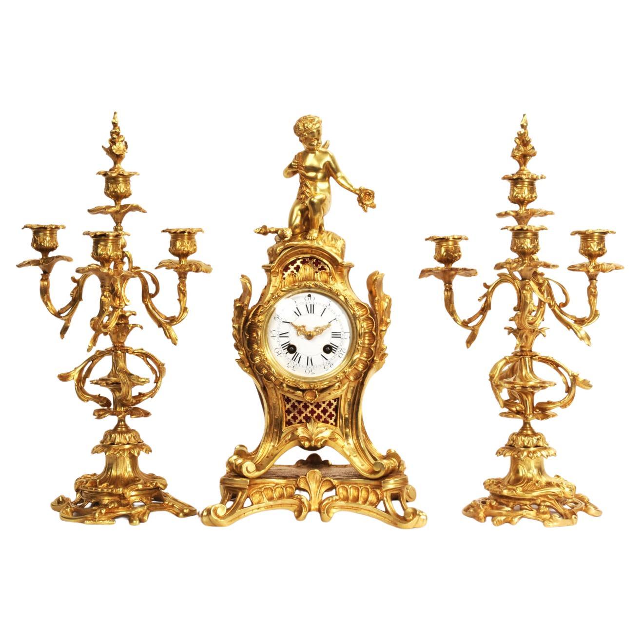 Pendule ancienne en bronze doré de style rococo - Cupidon