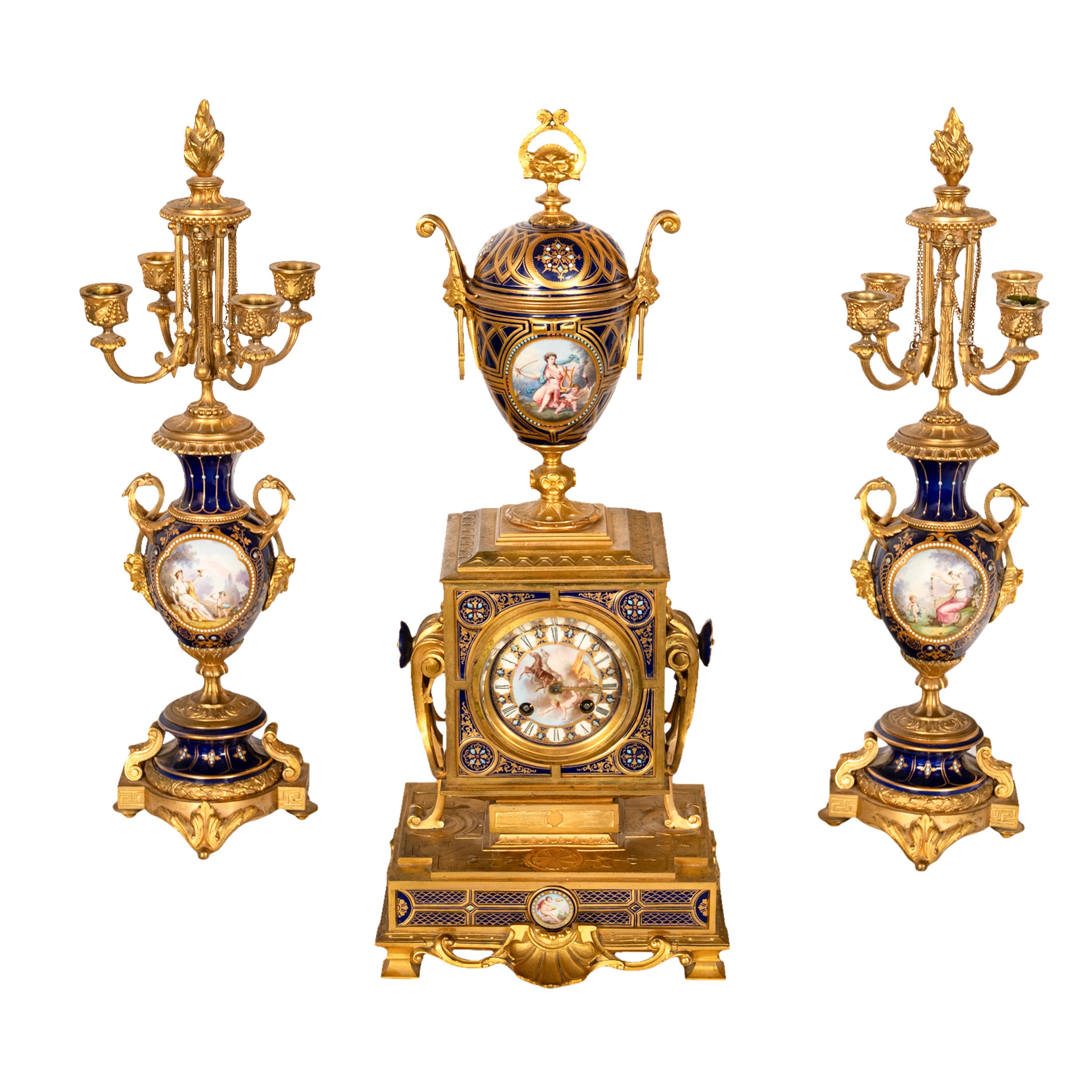An outstanding quality antique gilded bronze & Sevres porcelain French 3 piece, 8 day clock garniture with candelabra, by Brocot & Delettrez, Paris, circa 1870.

The clock with an 'egg' shaped urn made of cobalt blue Sevres porcelain with a
