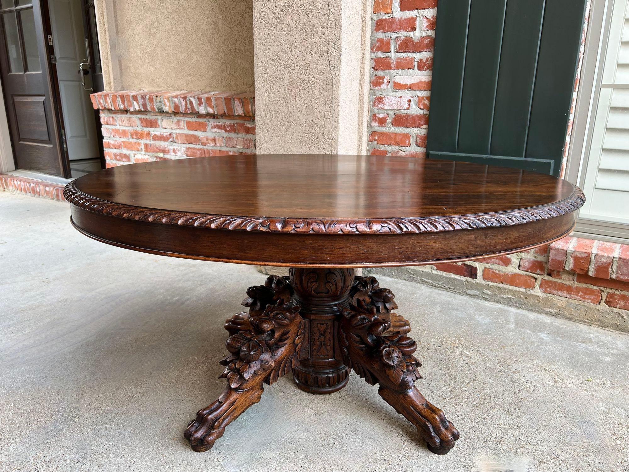 Antique French Oval Center Hunt Lodge Table Carved Black Forest Pedestal Coffee Table.

Direct from France, a large and substantial 19th century hand carved solid oak table!! Superior carvings, craftsmanship and artistry; the huge turned pedestal