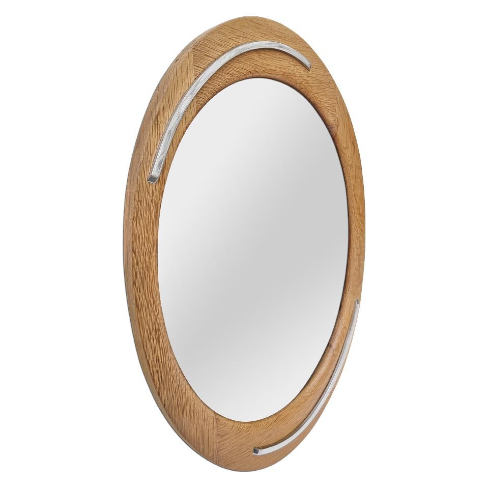 French design vintage oval mirror, circa 1960. Antique natural oak wood frame orned with stainless steel elements in the shape of a curved lines. Antique frame width: 5 cm / 1.96 in. Modern glass mirror. Antique wood back.