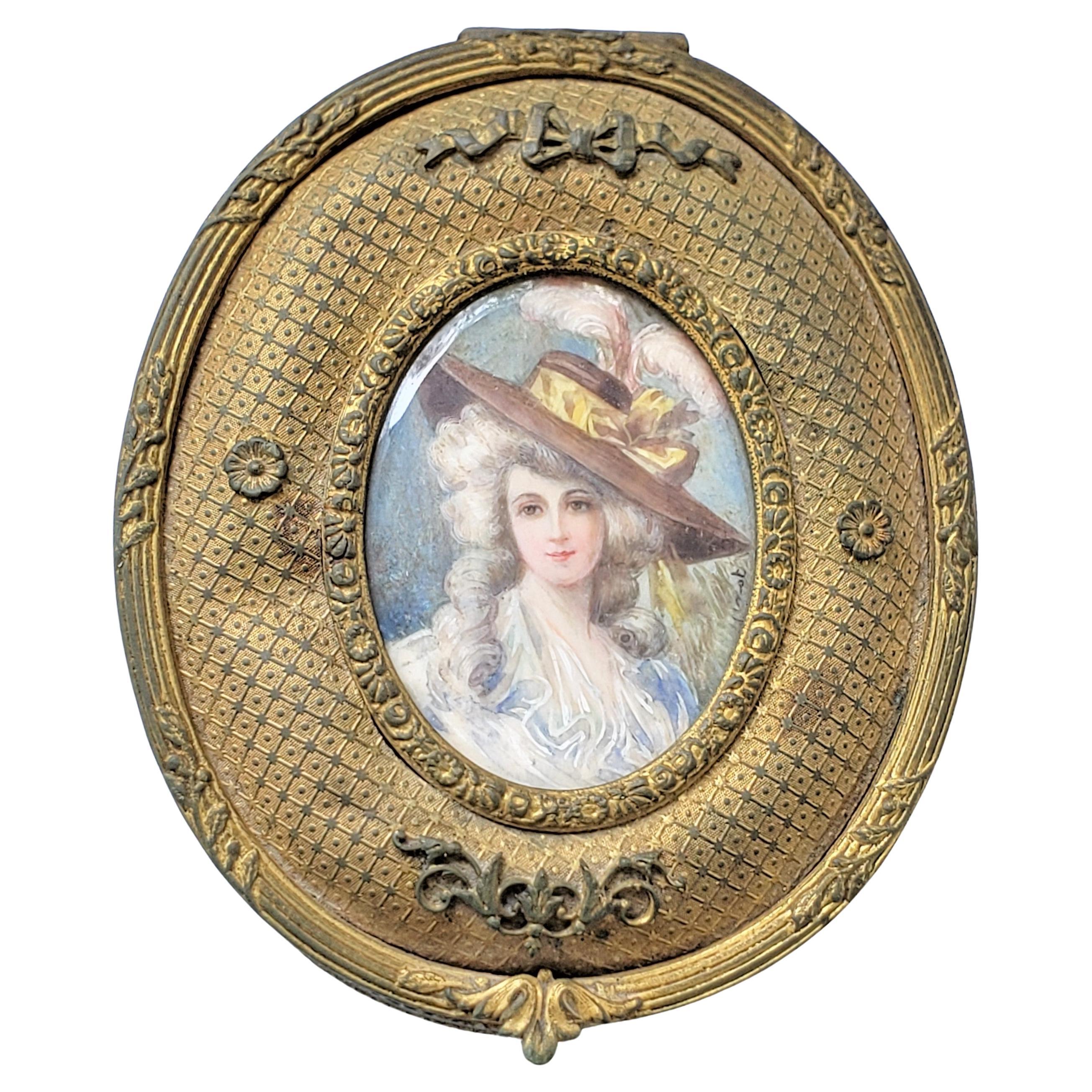 Antique French Oval Gilt Finished Metal Box with Signed Hand-Painted Portrait For Sale