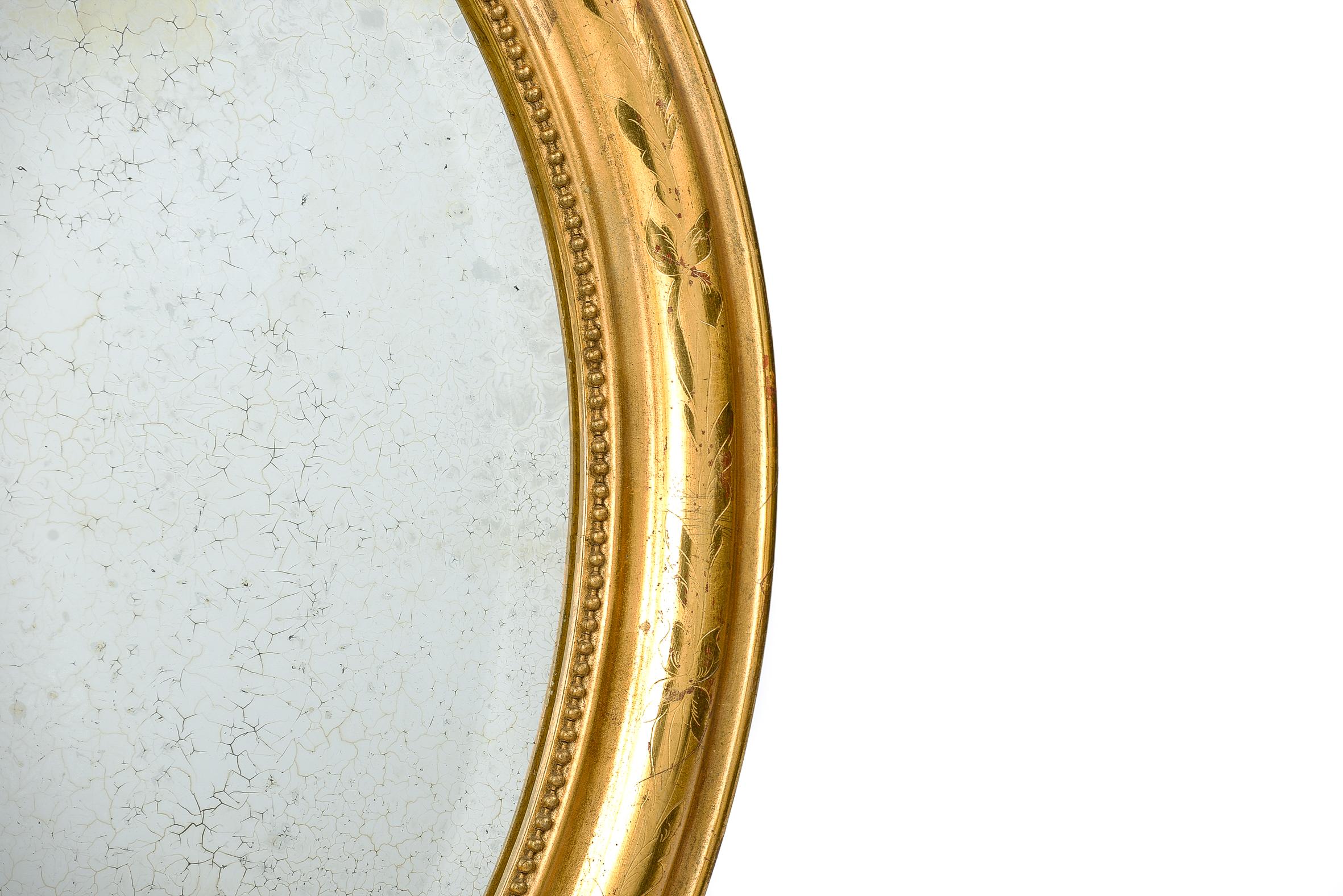 antique oval gold mirror
