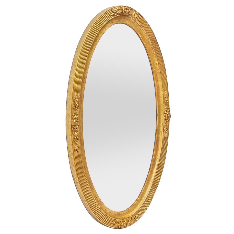 Antique French oval wall mirror in gilded wood patinated, Art Nouveau period, circa 1900. Antique frame orned with flowers and grooves. Re-gilding with leaf. Frame width: 5 cm / 1.96 in. Modern glass mirror. Wood back.
