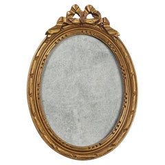 Antique French Oval Photo Frame In Gilded Carved Wood With Bow, circa 1900