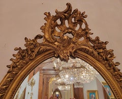 Antique French Oval Shaped Gold-Leaf Framed Mirror with Beveling, Circa 1895.