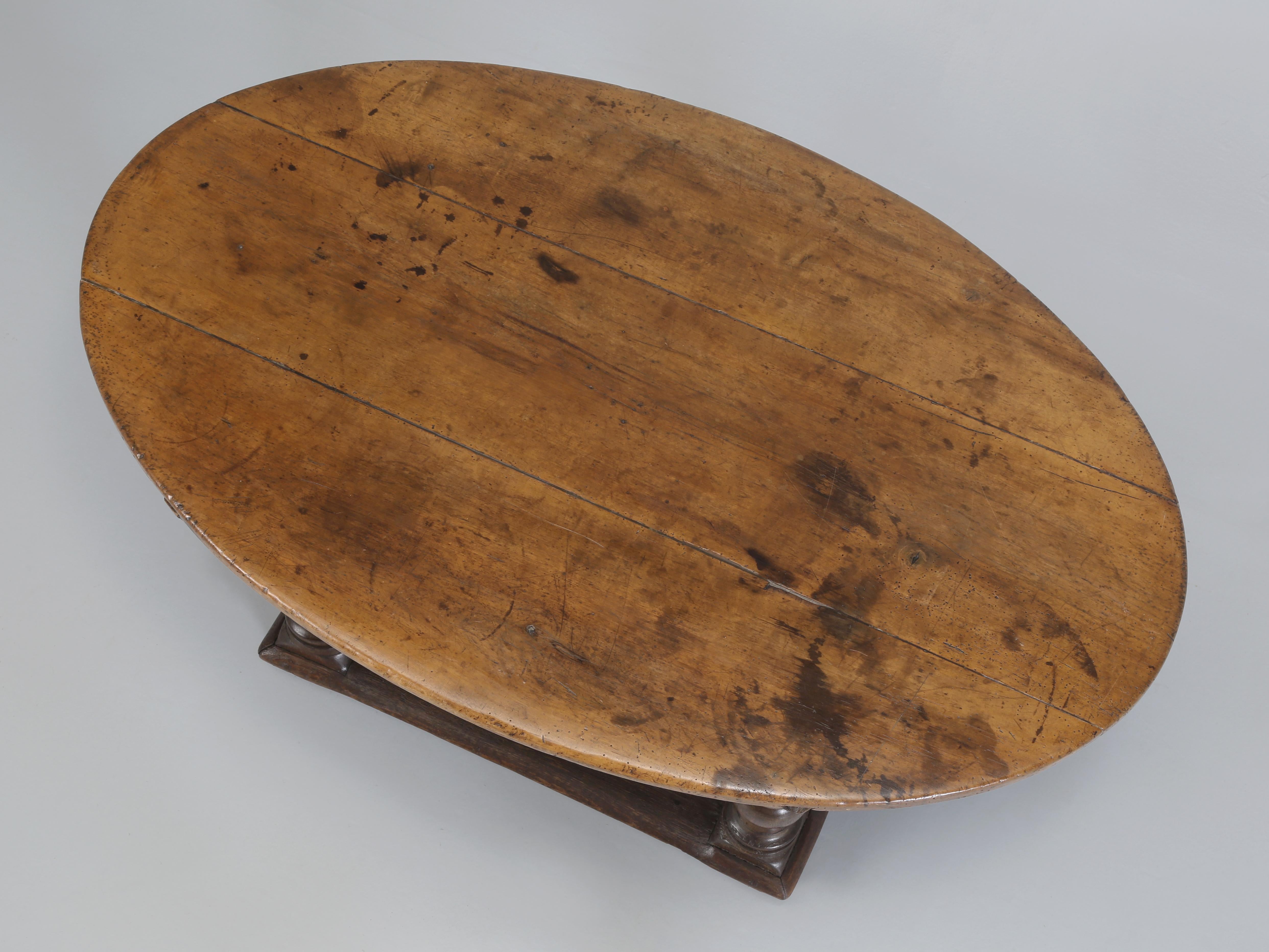 Antique French Oval Walnut Coffee Table or Tea Table that was hand-made during the 1700's and enjoys an unbelievable all original patina that words simply cannot do justice to. The height of this Antique Oval Walnut Coffee Table enables it to be