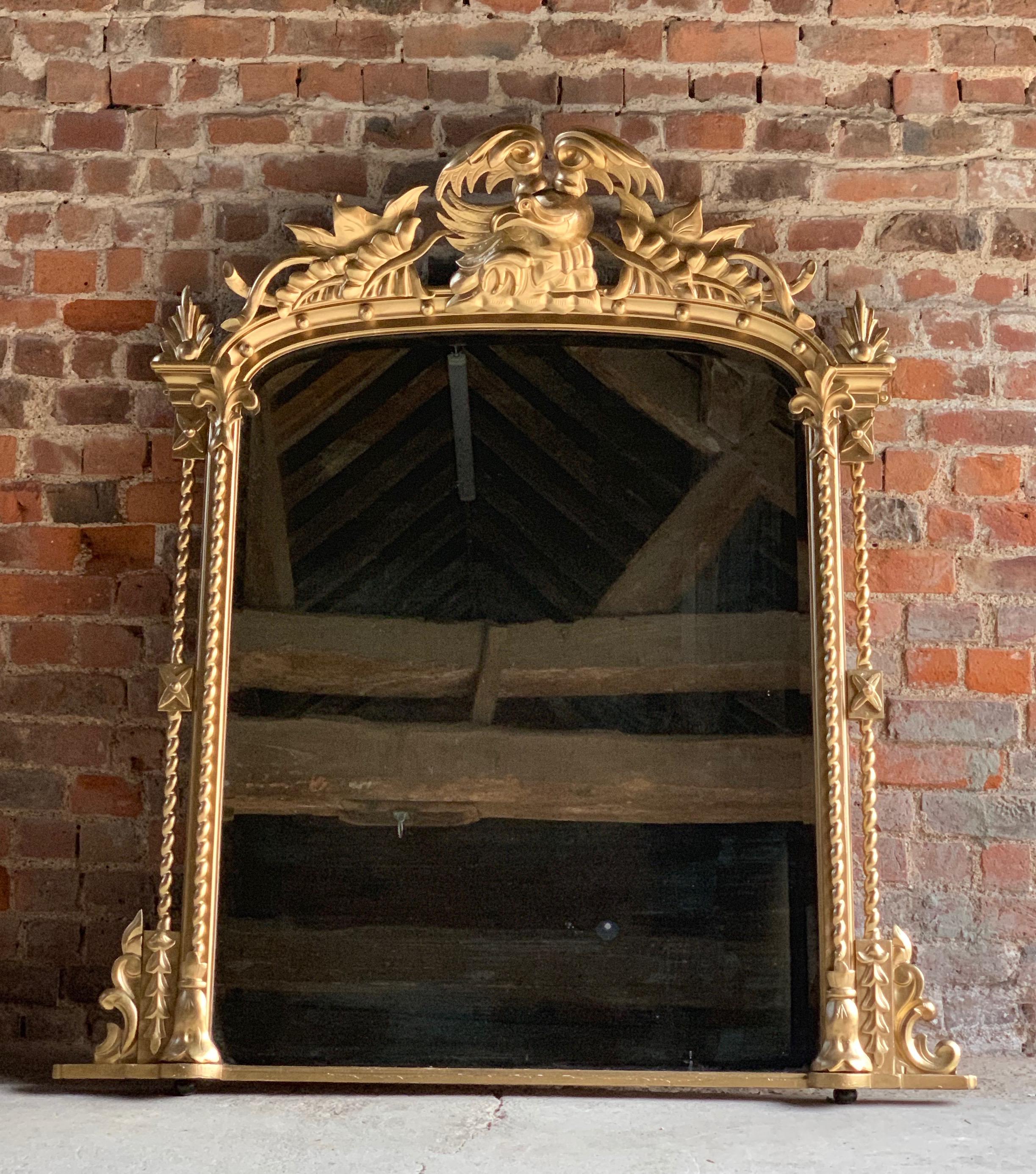Antique 19th century French Louis XV style overmantle mirror, circa 1875.

Magnificent Antique 19th century French Louis XV style overmantel mirror, circa 1875, the gold painted wooden frame richly adorned with a large central cartouche, with