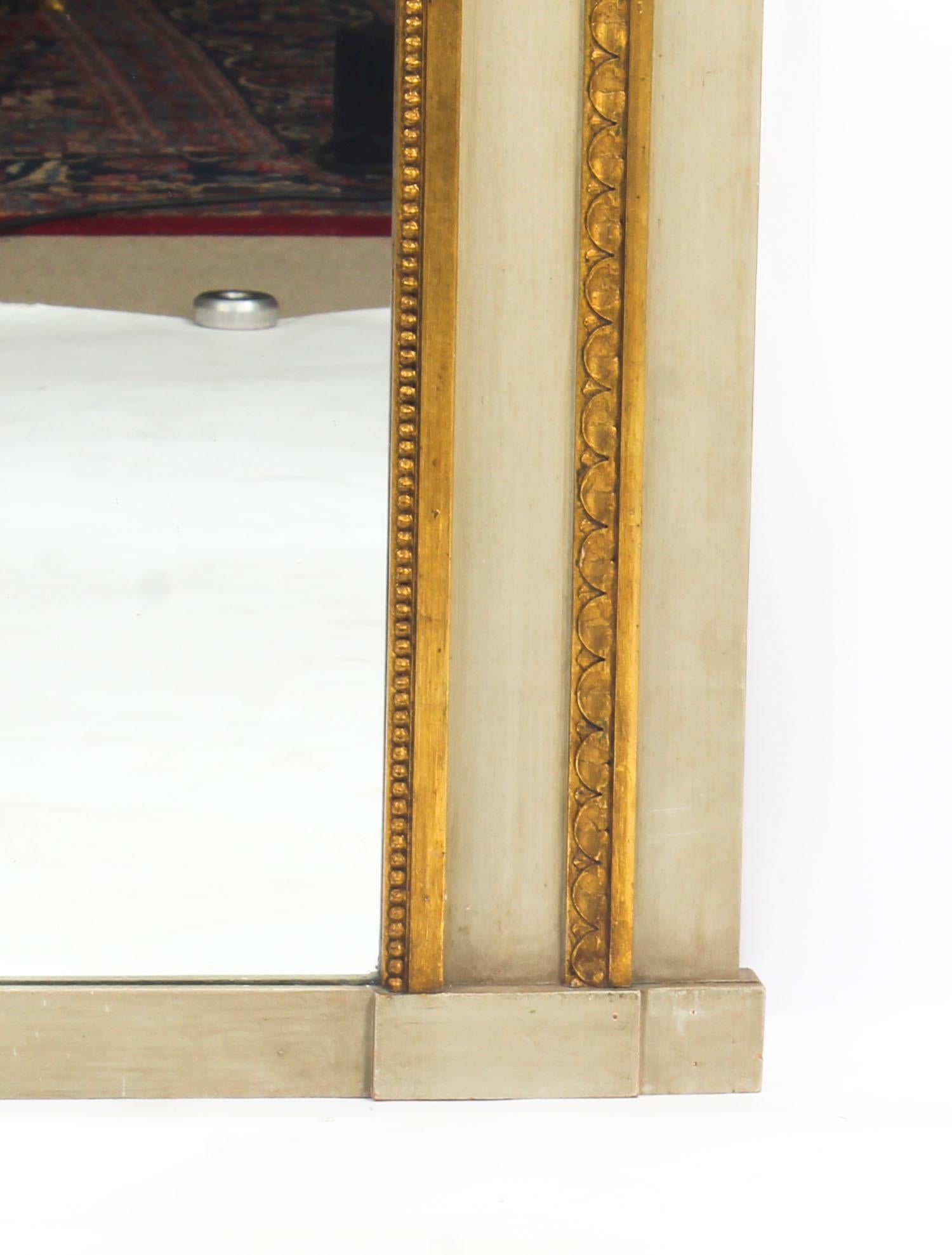 A beautiful Antique French painted and parcel-gilt trumeau mirror, late 19th century in date.

The mirror features a central shaped panel with a carved zigzag frame with a beautiful oil painting depicting an Italianate scene of a courting couple