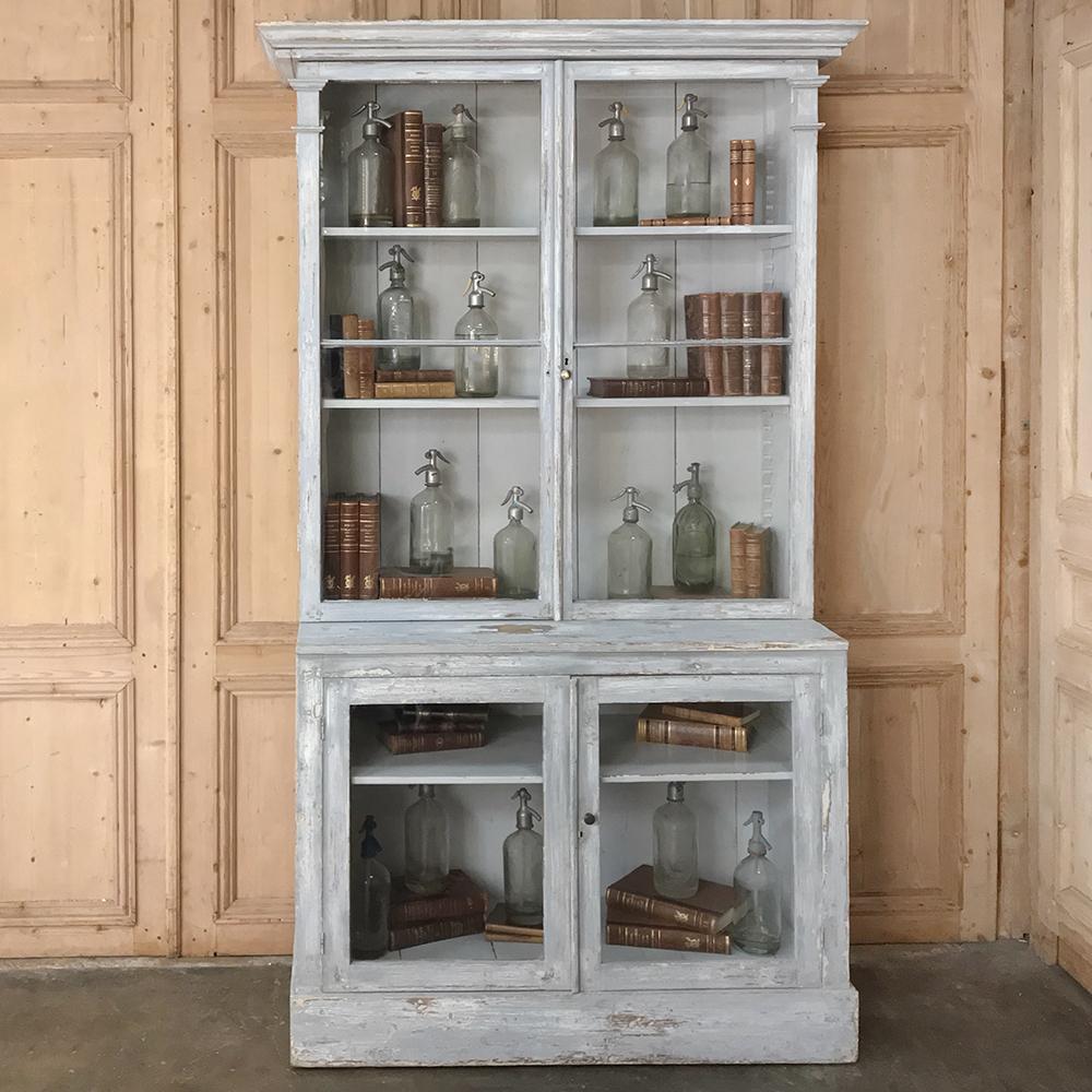 Antique 19th century Swedish painted and scraped pine bookcase is a grand way to display your books, memorabilia or collection. Classic elegant neoclassical architecture is enhanced by the subtle carved detail and the original painted finish. The