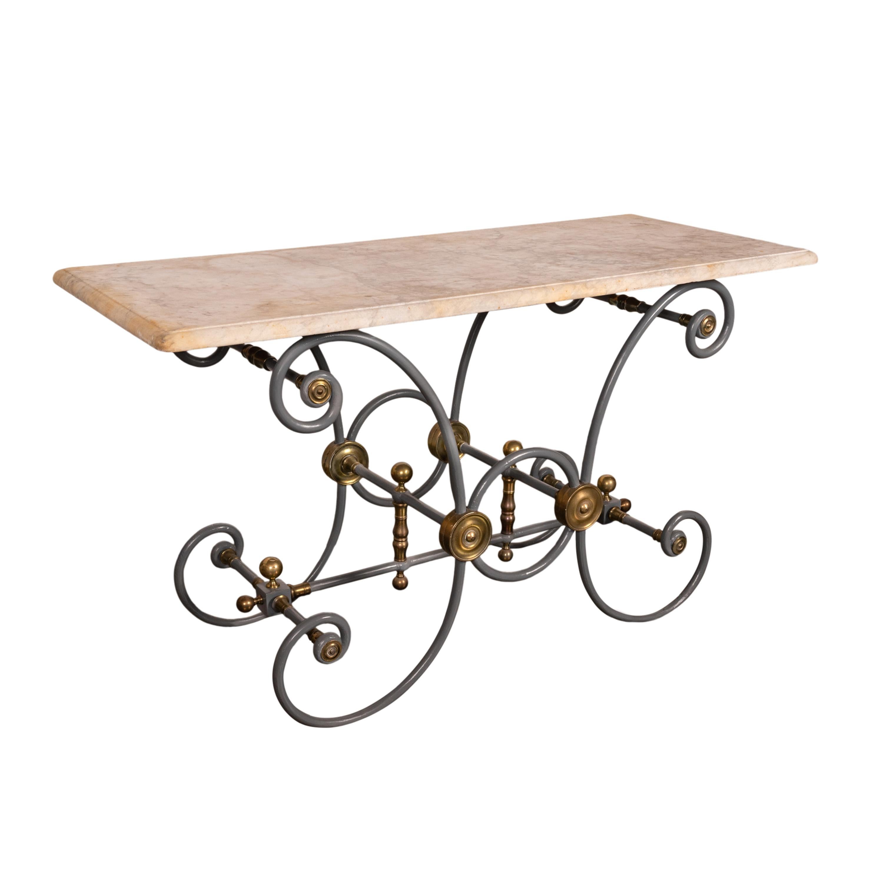 Antique French Provincial painted iron & brass marble top baker's table, circa 1880.
This very handsome table having the original white marble top, the top having a finished curved edge on each side allowing the table to be in the middle of a