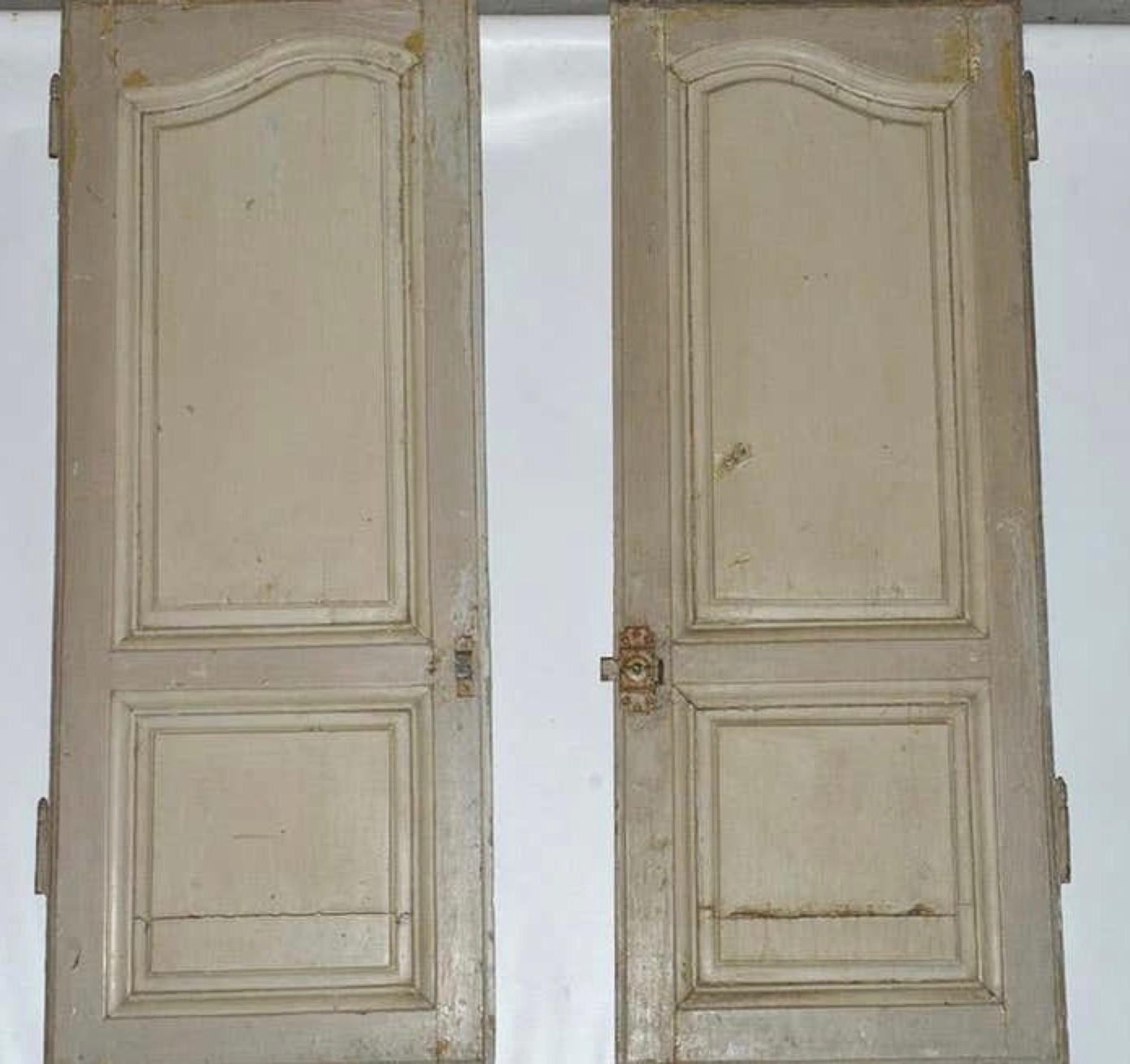 Slightly distressed French Provincial paneled doors for a cabinet this striking pair of doors wear their age with grace, and would bring character in creating a cupboard for storage, pantry in a kitchen or a standalone cabinet. They also work