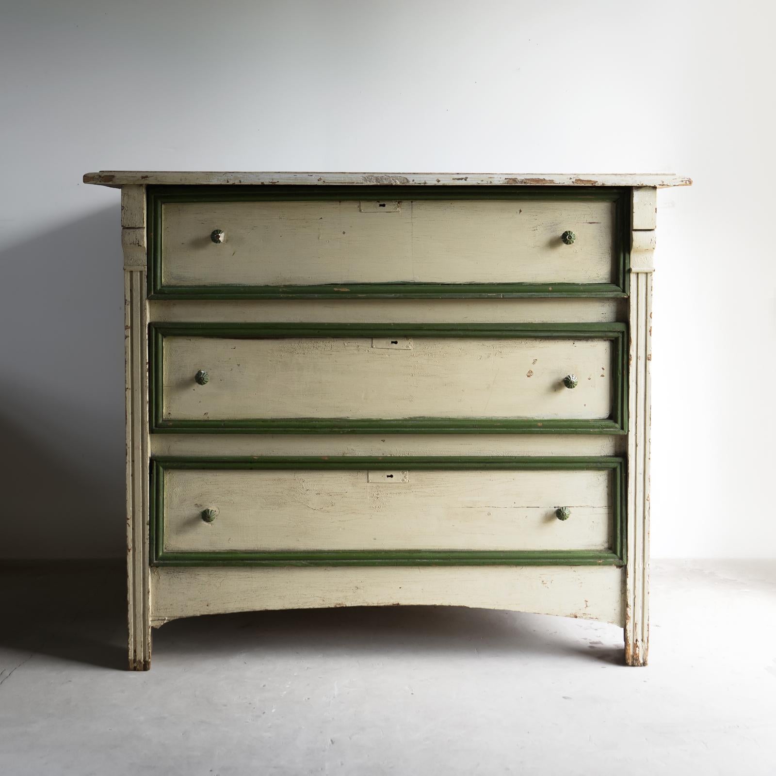 ANTIQUE FRENCH CHEST OF DRAWERS

Of fairly large proportions with three equally sized deep drawers.

Constructed of pine in a provincial chunky manner with panelled sides and decorative carved uprights and moulded details. 

Small porcelain handles