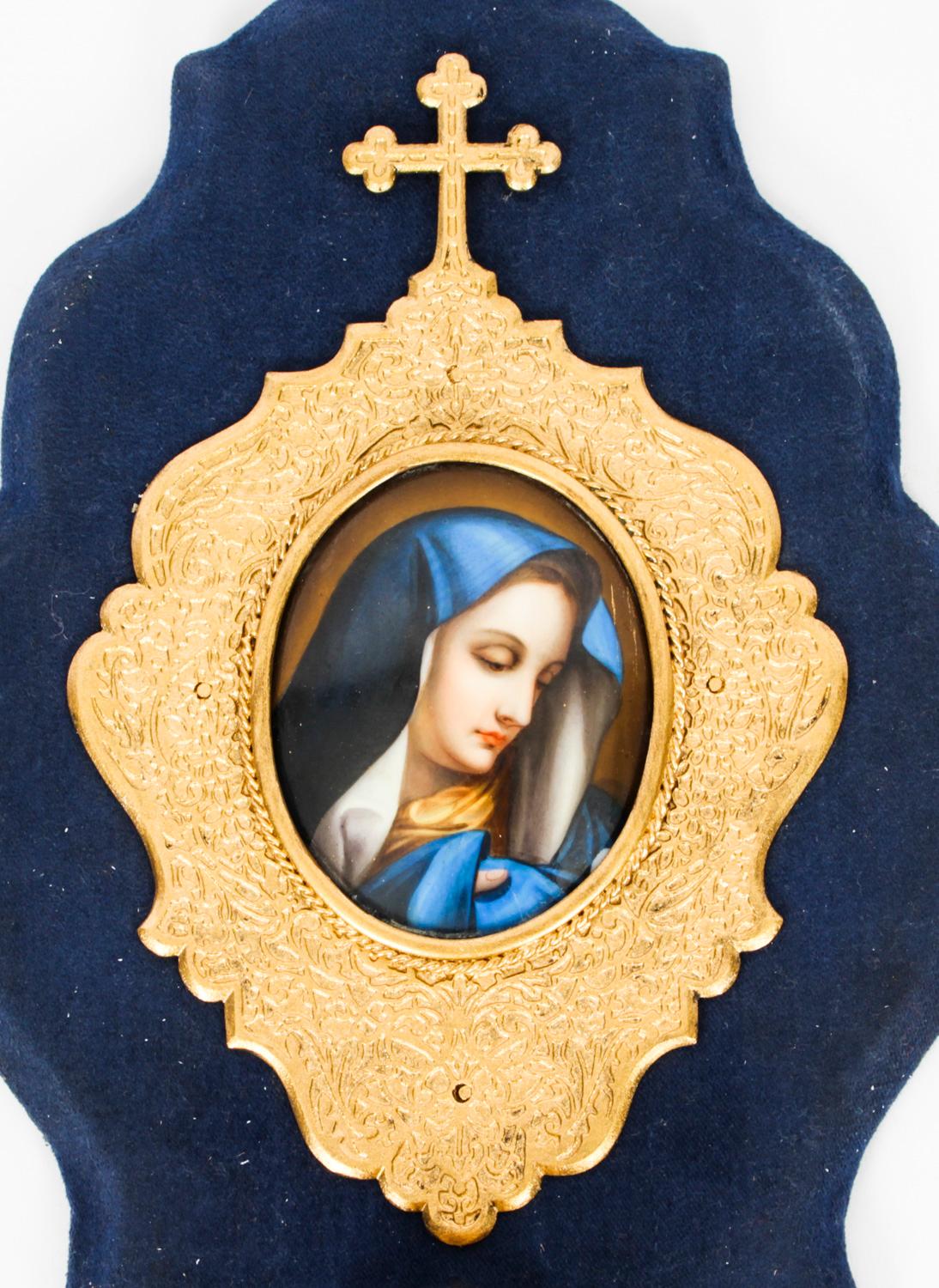 This is a beautiful French porcelain and ormolu wall hanging holy water stoop, Circa 1890 in date.
 
The shaped plaque features a cross above an oval hand painted porcelain plaque, in the manner of KPM, depicting the Madonna, with a lidded holy