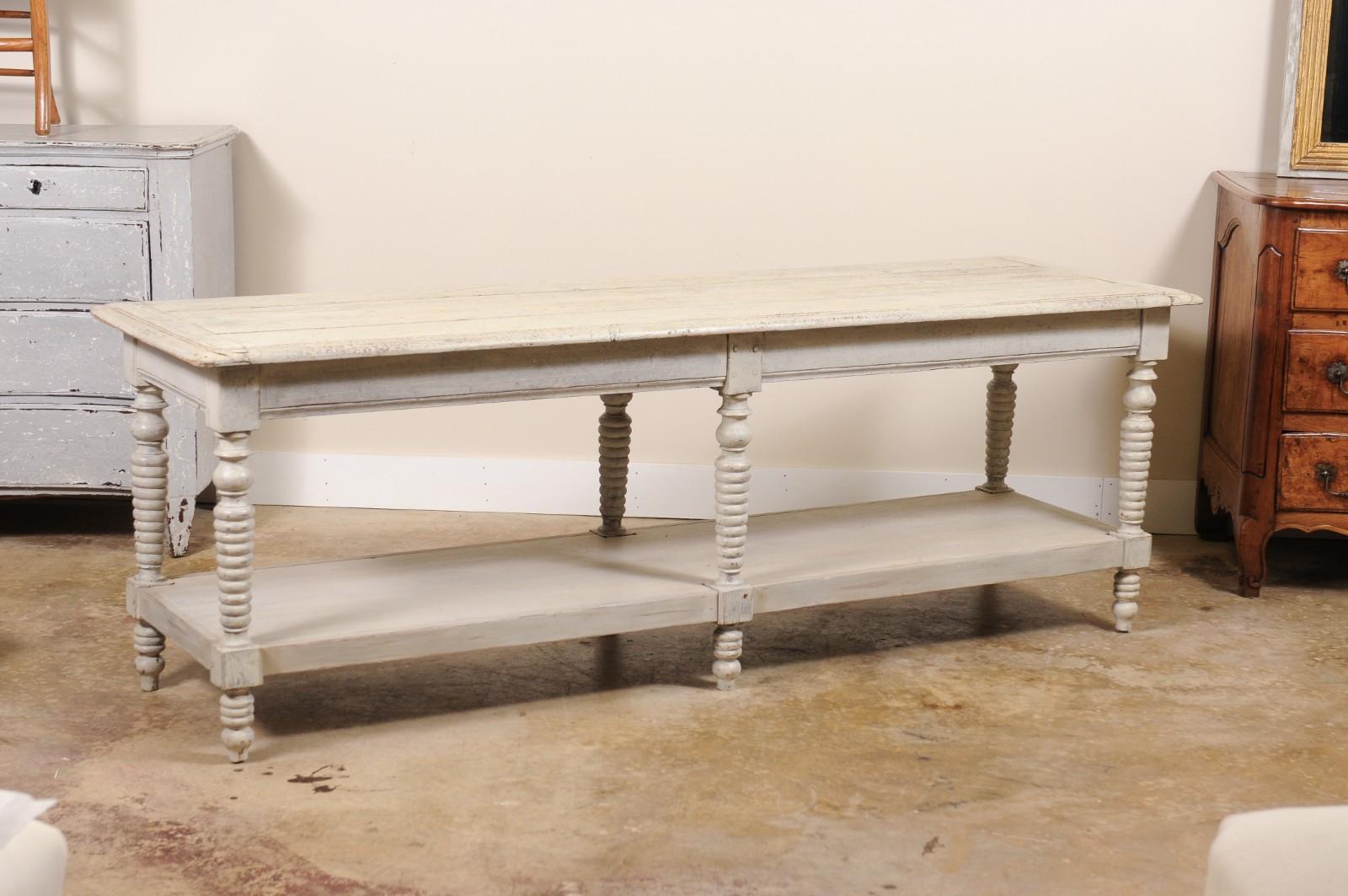 A draper's table, also called a drapers table is a large sturdy table traditionally used by cloth merchants for measuring and cutting fabric.  These tables are characterized by thier spacious flat surface and ofter feature drawers and a lower shelf