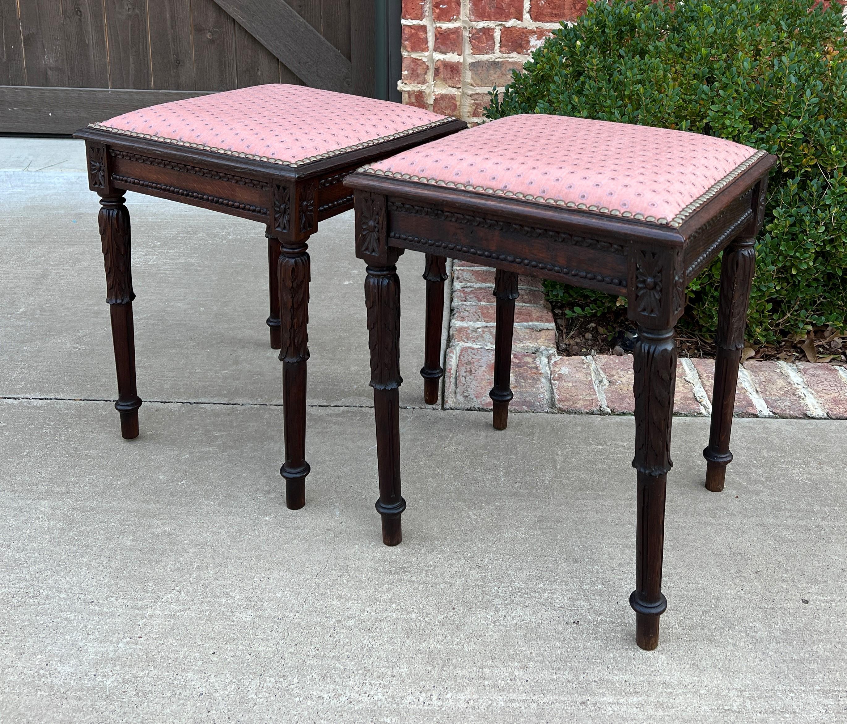 CHARMING Antique Pair of French Oak Stools, Footstools, or  Small Benched with Upholstered Tops~~c. 1890s

Classic French flair carved oak decorator pieces with upholstered seats with brass nail head tacks~~nicely carved oak skirts and