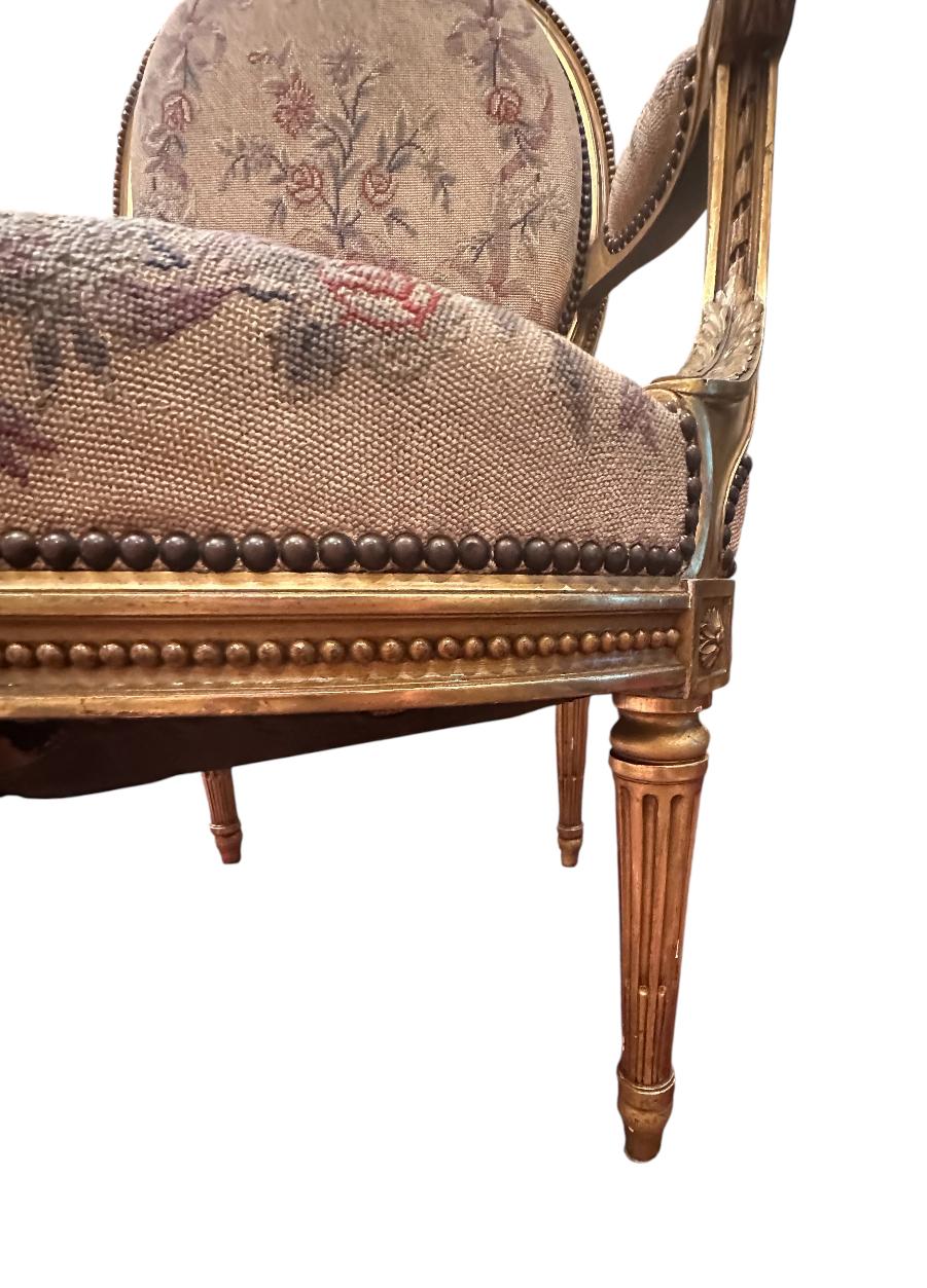 Upholstery Antique French Pair of Louis XVI Style Carved Giltwood Fauteuils For Sale