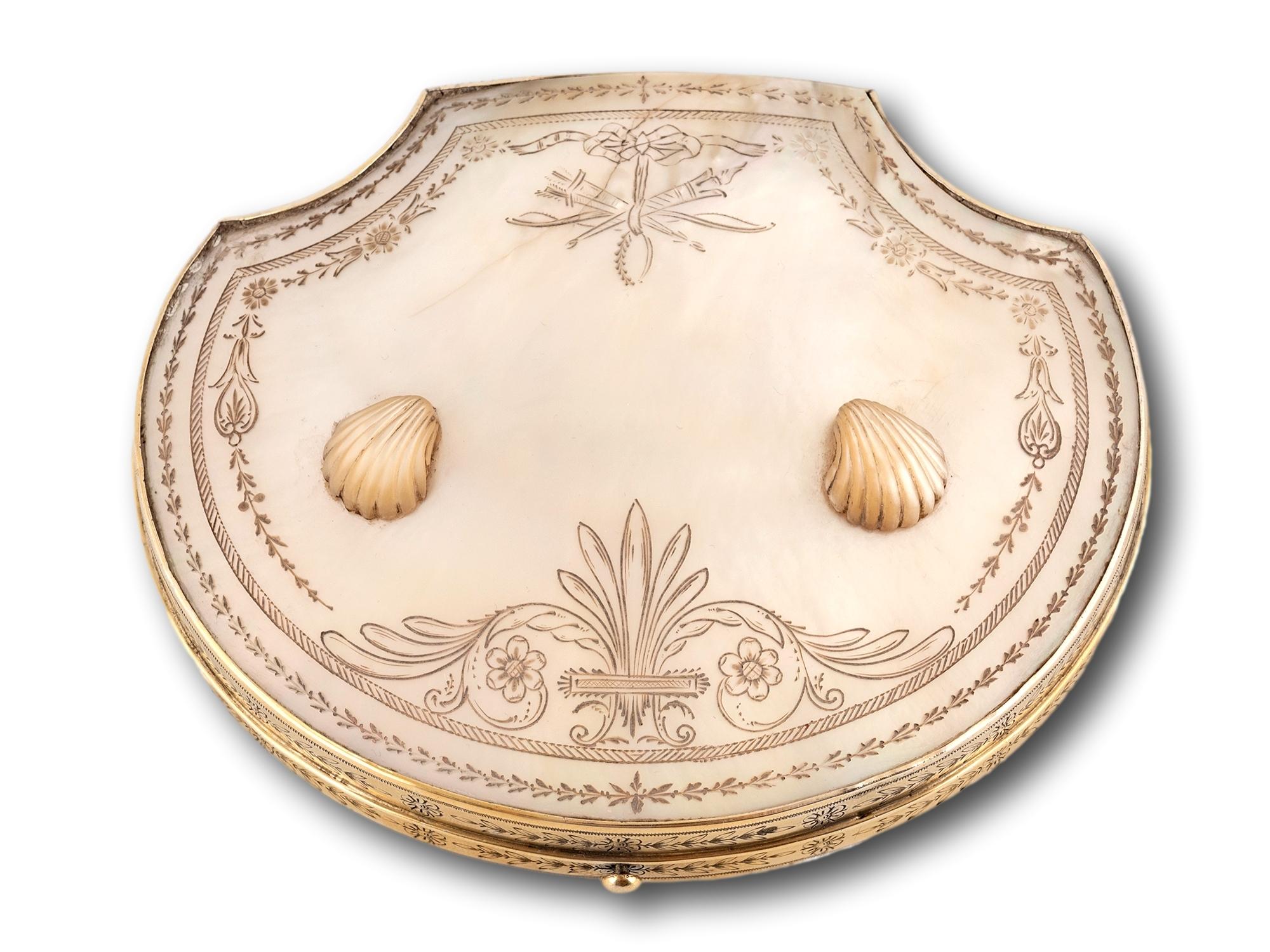 Mother of Pearl and Ormolu 

From our Sewing collection, we are delighted to offer this Palais Royal Necessaire Etui. The Etui of rare clam shell shape framed in ormolu with engraved mother of pearl panels mounted with two smaller clam shells. The