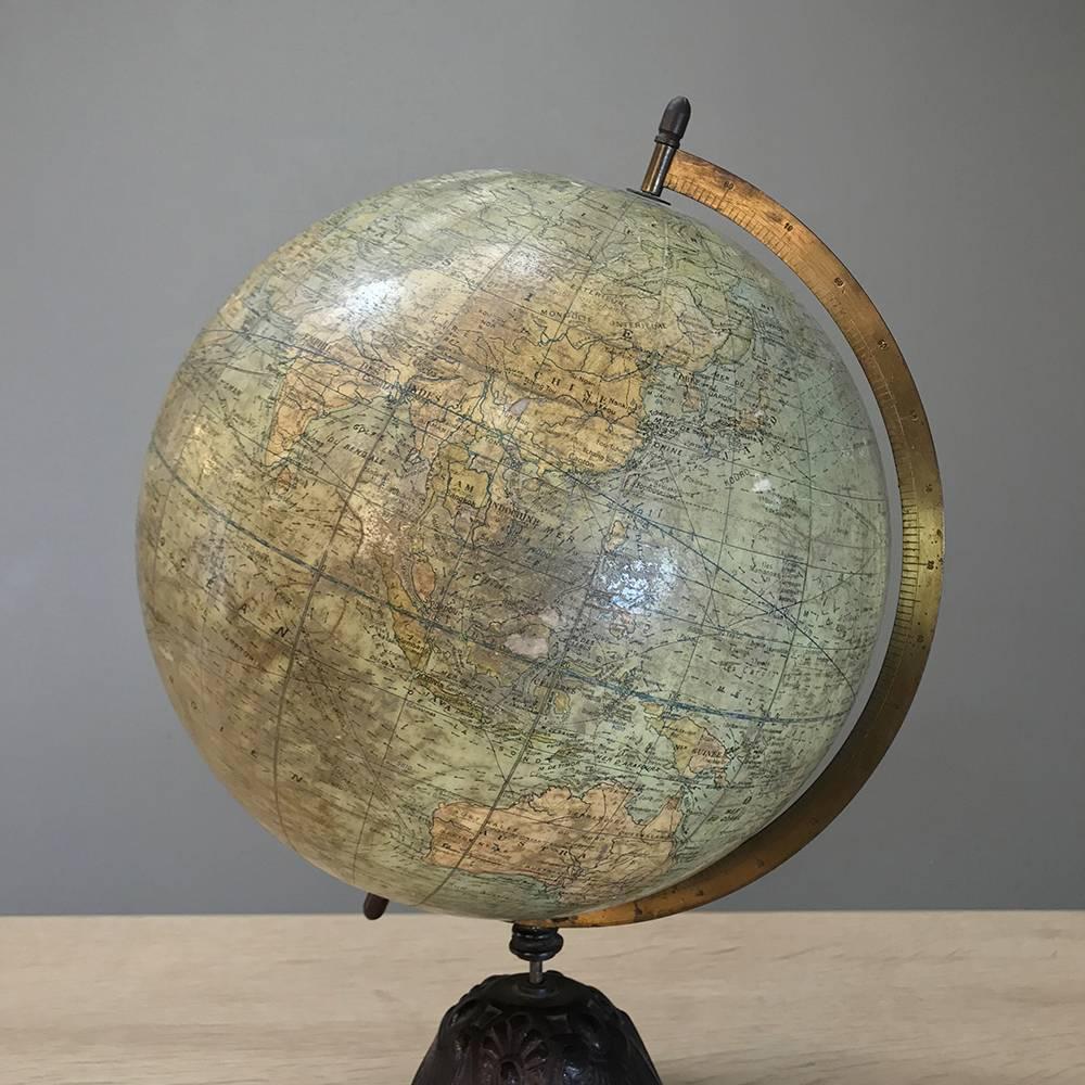 Antique French World Globe on cast iron tripod. Very good condition and  with original patina.
This wonderful globe makes great addition for any office desk or library.
circa early 1890s.

Measures: 20.5 height x 12 in diameter.