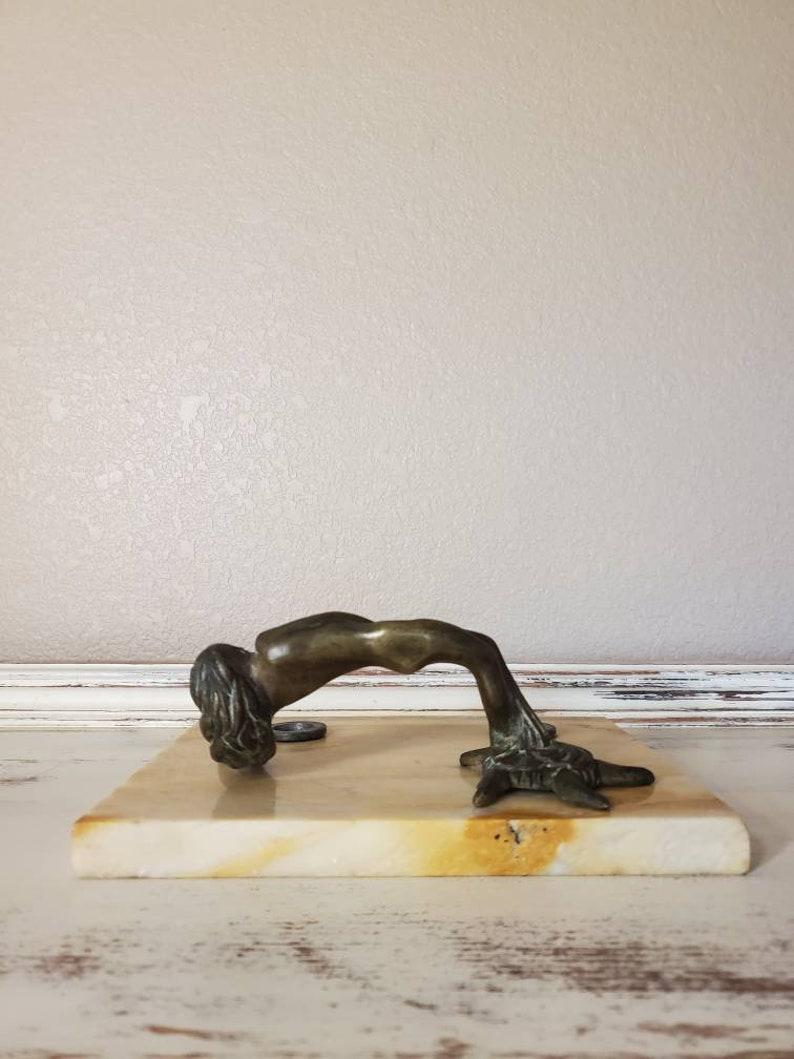 A spectacular and unique period Parisian Art Nouveau bronze. Handcrafted in Paris, France in the late 19th- early 20th century, having a rectangular marble base, fitted with two removable inkwells, featuring a sculpted bronze handle in the form of a