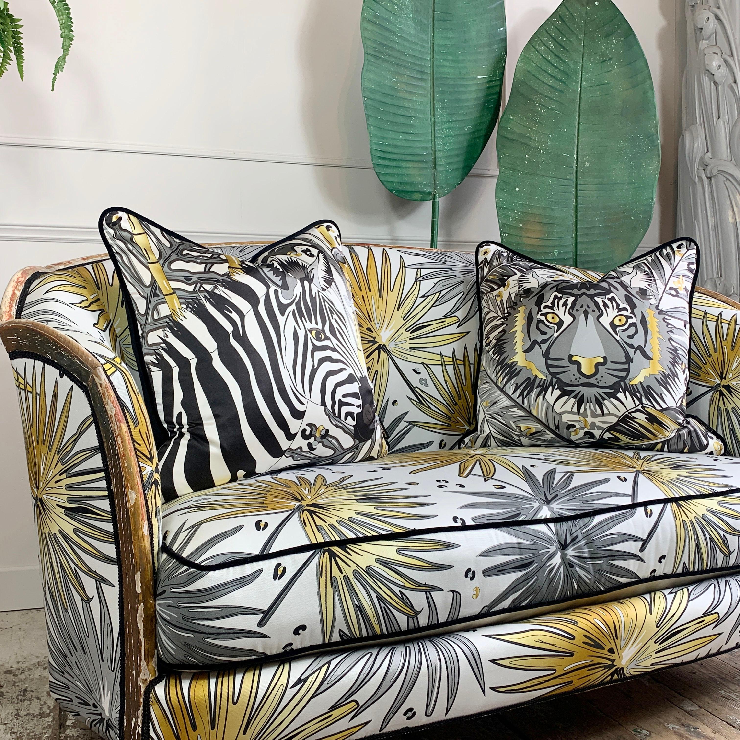 A very rare antique French Parlour Settee, upholstered in our exclusive Tropics 'Fan Palm' fabric

This exceptional French settee dating from around 1880, has been painstakingly covered in the luxurious Fan Palm fabric from our Tropics range,
