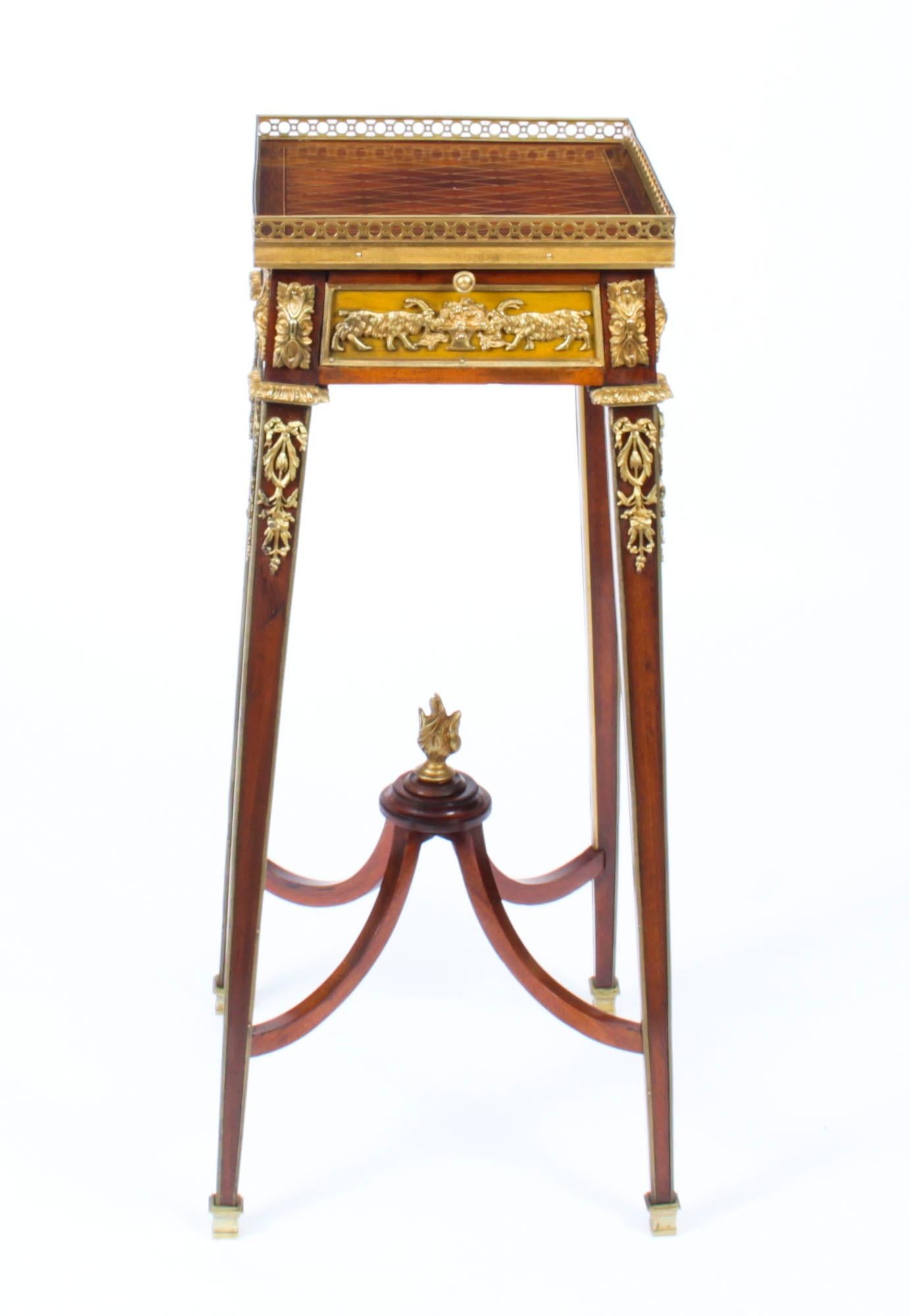 This is a fine antique French ormolu mounted mahogany and specimen wood parquetry stand firmly attributed to François Linke, Circa 1890 in date.

The square galleried top features beautiful parquetry decoration with ebony and box-wood stringing. The