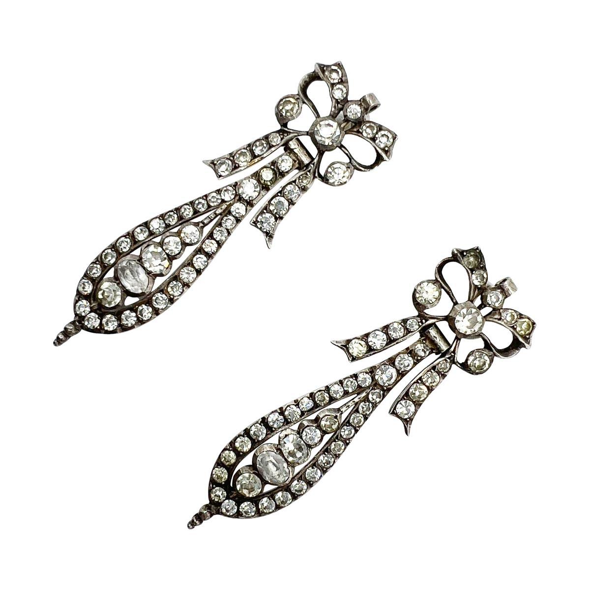 A very special and rare find, a pair of Antique French Paste Earrings crafted in France. Designed in the highly sought-after Pendeloque bow style, the earrings dating to the early Victorian Period yet influenced by the famed Portuguese style