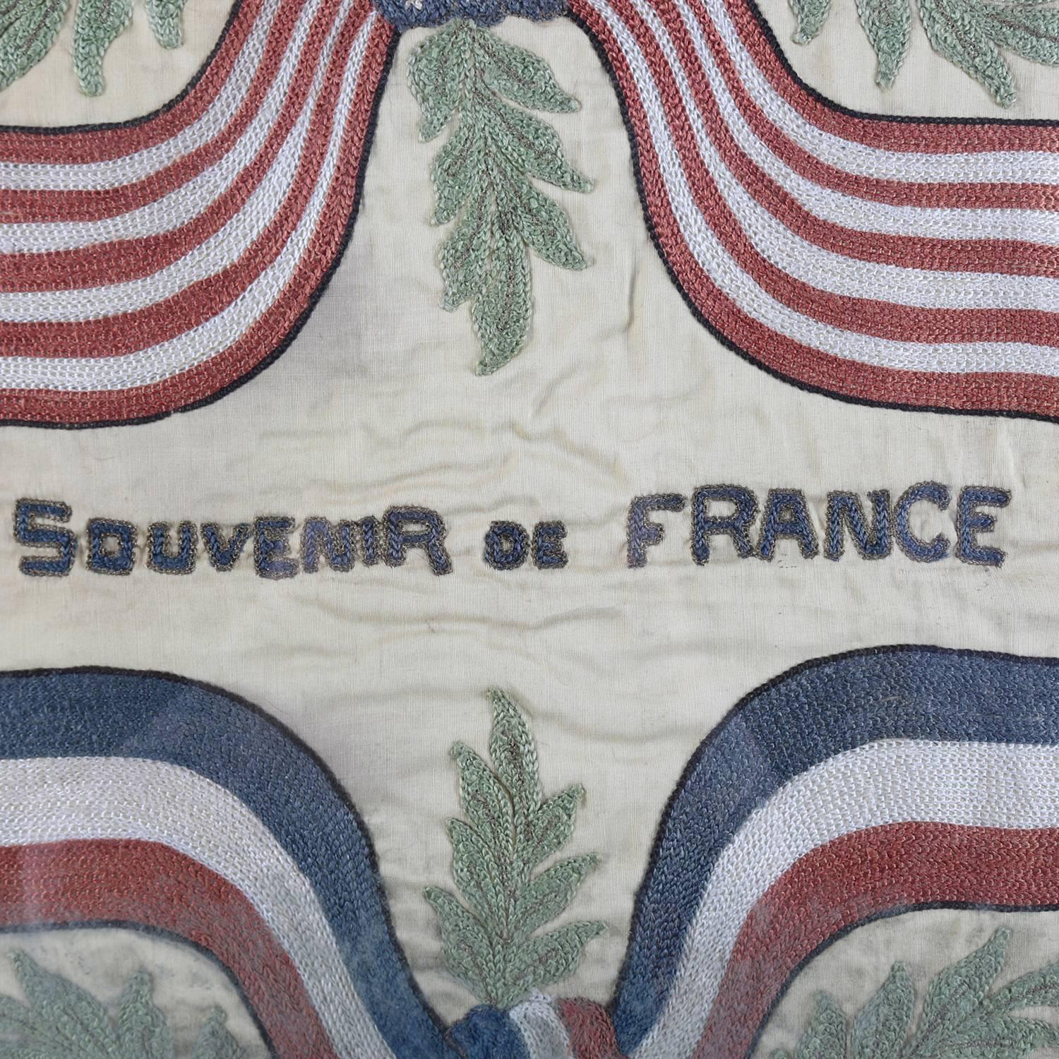 Framed antique French embroidered souvenir linen features central 